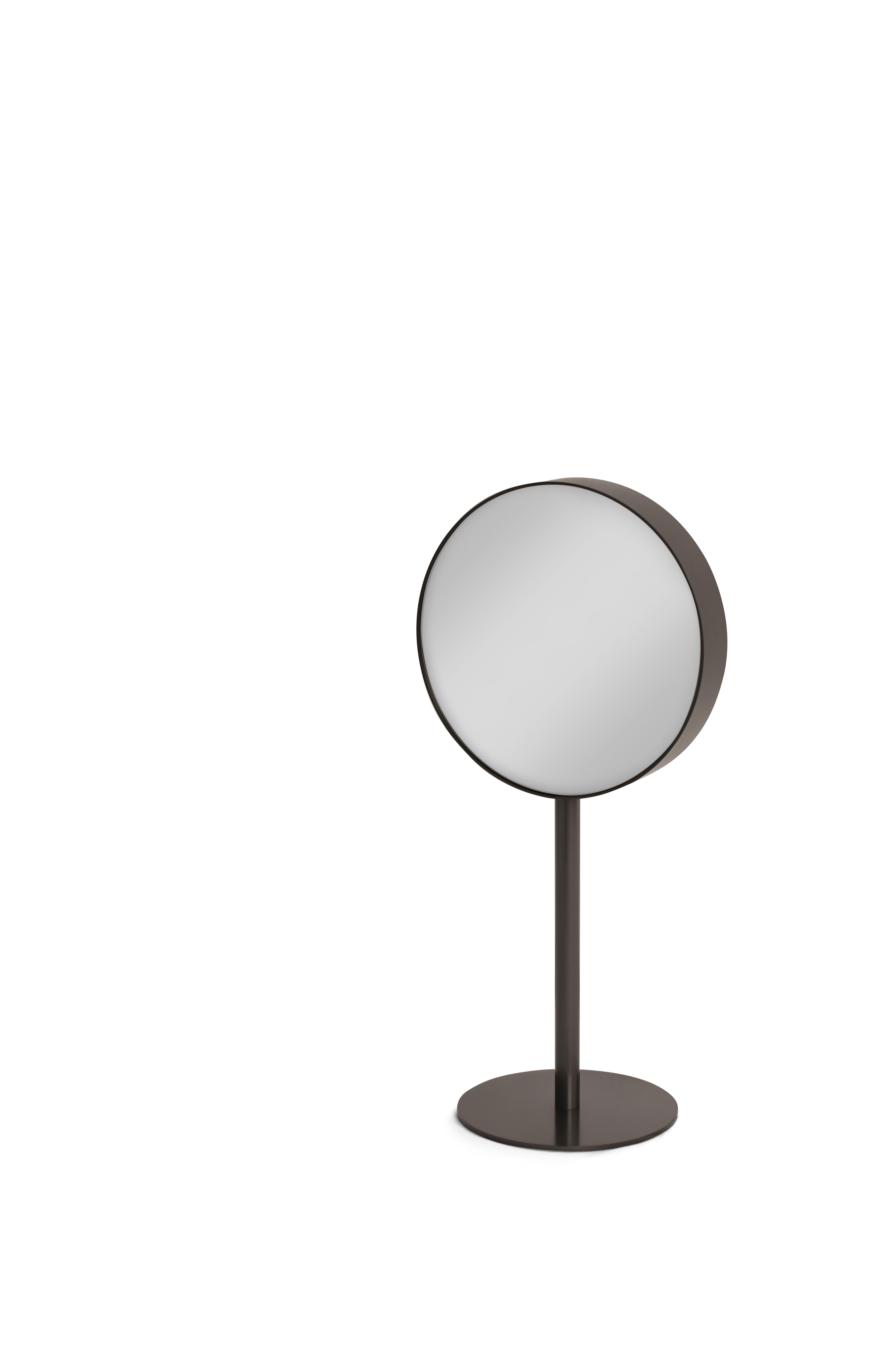 Loop Mirror by Redeco
Dimensions: W 20 x D 15 x H 43 cm
Materials: Mirror, back side with magnifying mirror, Biotite satin metal.

ReDéco is a truly solid company, capable of building and creating furnishings, but also a company that can transmit