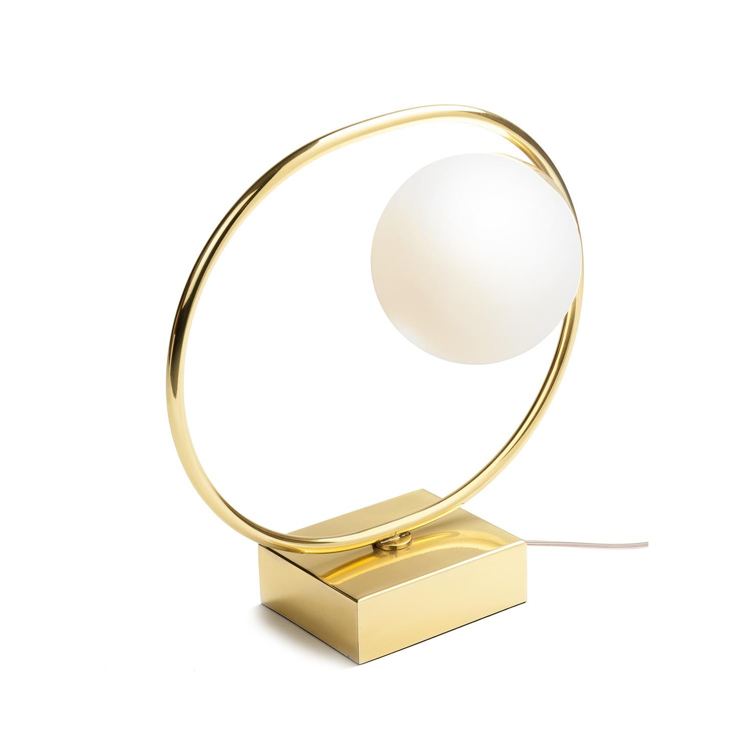 Loop Table Lamp evokes a sense of playfulness thanks to the juxtaposition of primary shapes. It can be used to create a modern yet timeless space and resembles a modern, elegant sculpture, producing a magical luminous atmosphere, with its Art Deco