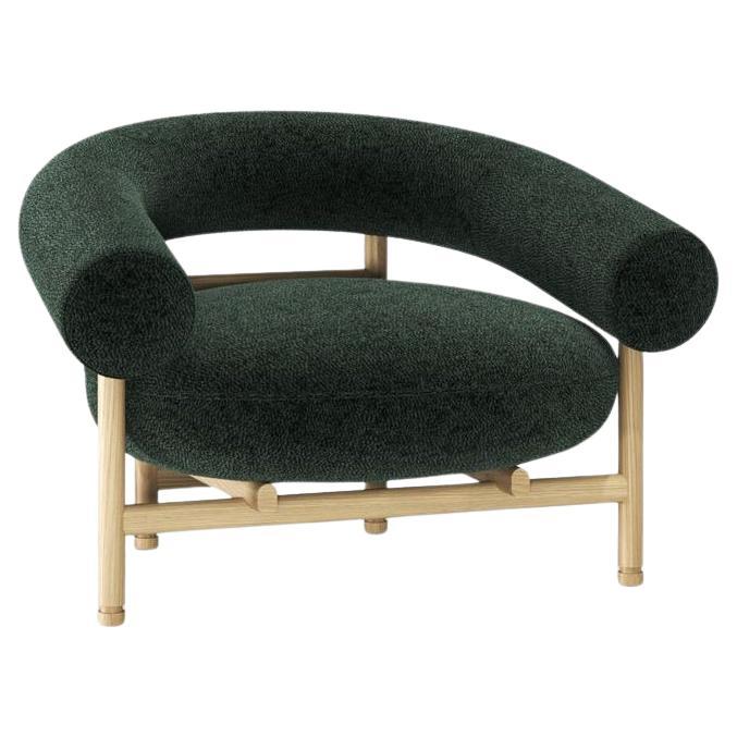 This lounge chair, inspired by timeless mid-century aesthetics, combines generous proportions with a sleek Nordic frame and robust wooden legs crafted using traditional techniques. The playful interplay of warm wood tones and plush upholstery adds a