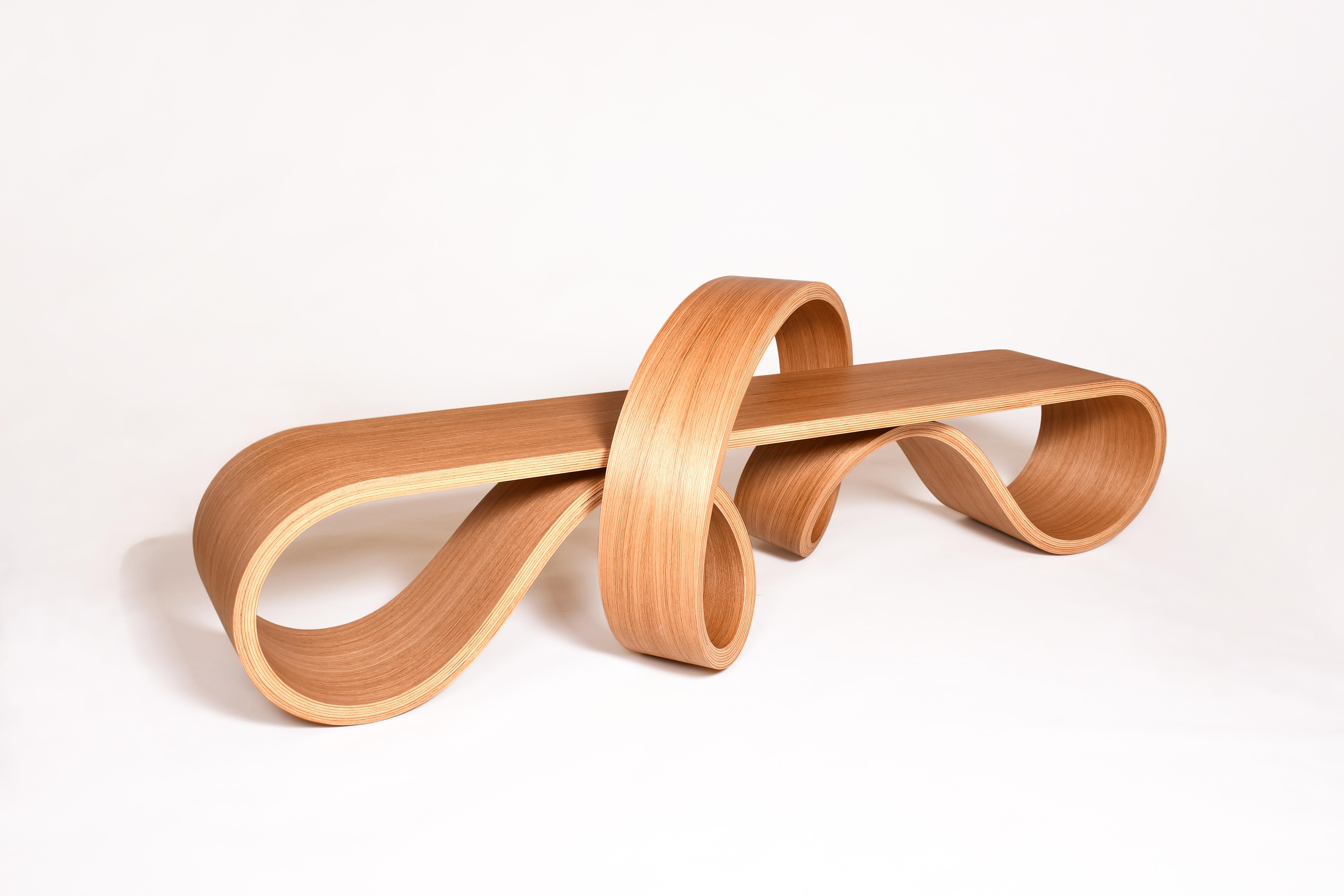 This bench has a very unique design, it's the result of many years of research on the technique of bent lamination. I created it in 2022 for a corporate customer, it was a part of four different benches for a building loby. If you look closely you