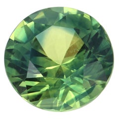 Zafiro suelto, talla brillante redondo 1,45ct AGL Solitario verde amarillento azulado