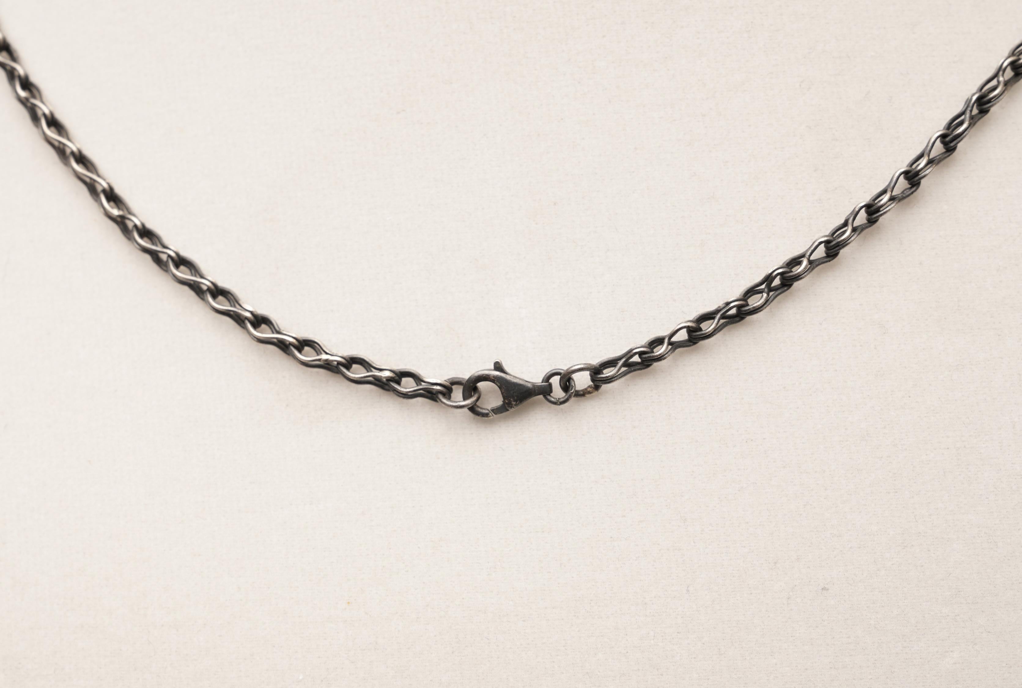 pendant with loose diamonds inside