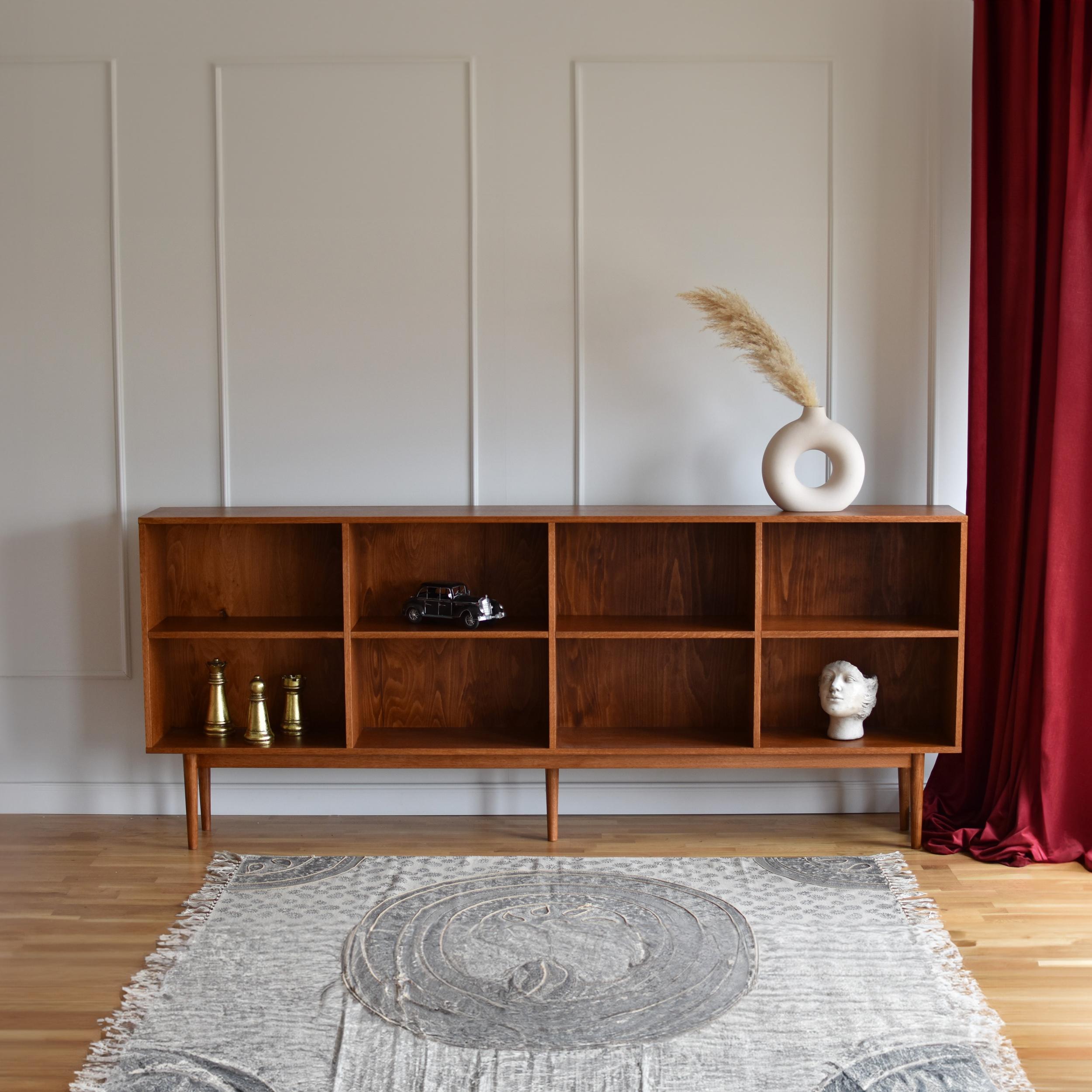 Lop Bookshelf by Pastform
Dimensions: D 40 x W 240 x H 100 cm.
Materials: Stained and varnished wood.

Available in different wood color finishes: Whiskey, Rum, BPA, Nobel, Brandy, Schwarz, Honey, Dark Brown, Cognac, Nevada, and Natura. Please