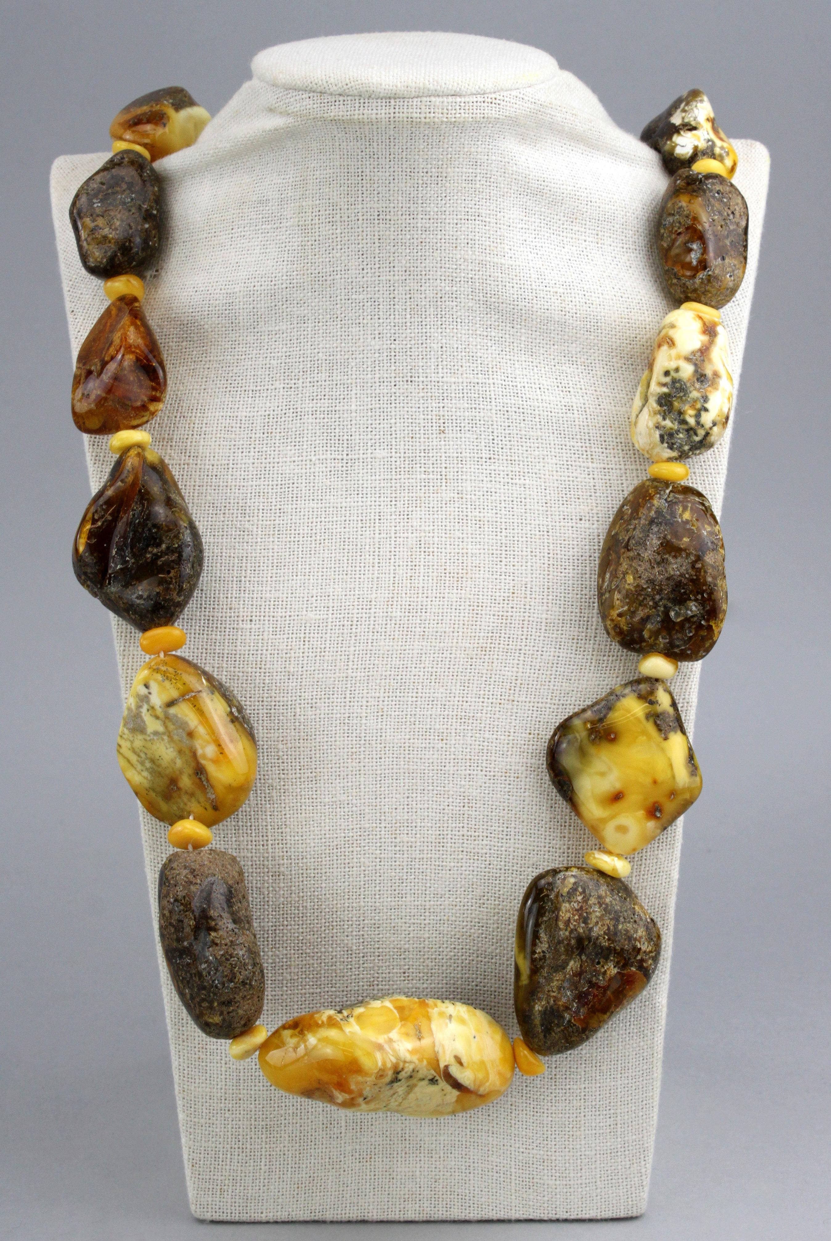 Loppe natural Baltic unpolished amber necklace.
Circa 1950's

Dimensions -
Length : 82 cm
Width : 4 cm
Weight : 182 grams

Amber - 
Largest Amber Stone Size : 6 x 3.8 x 2.8 cm
Medium Amber Stone Size : 4.5 x 4 x 1.8 cm
Treatment : Natural /