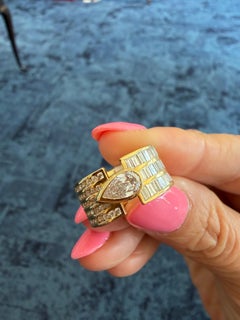 Loraida Vortex Ring in 18 Karat Yellow Gold with Pear Shape and Baguette Diamond