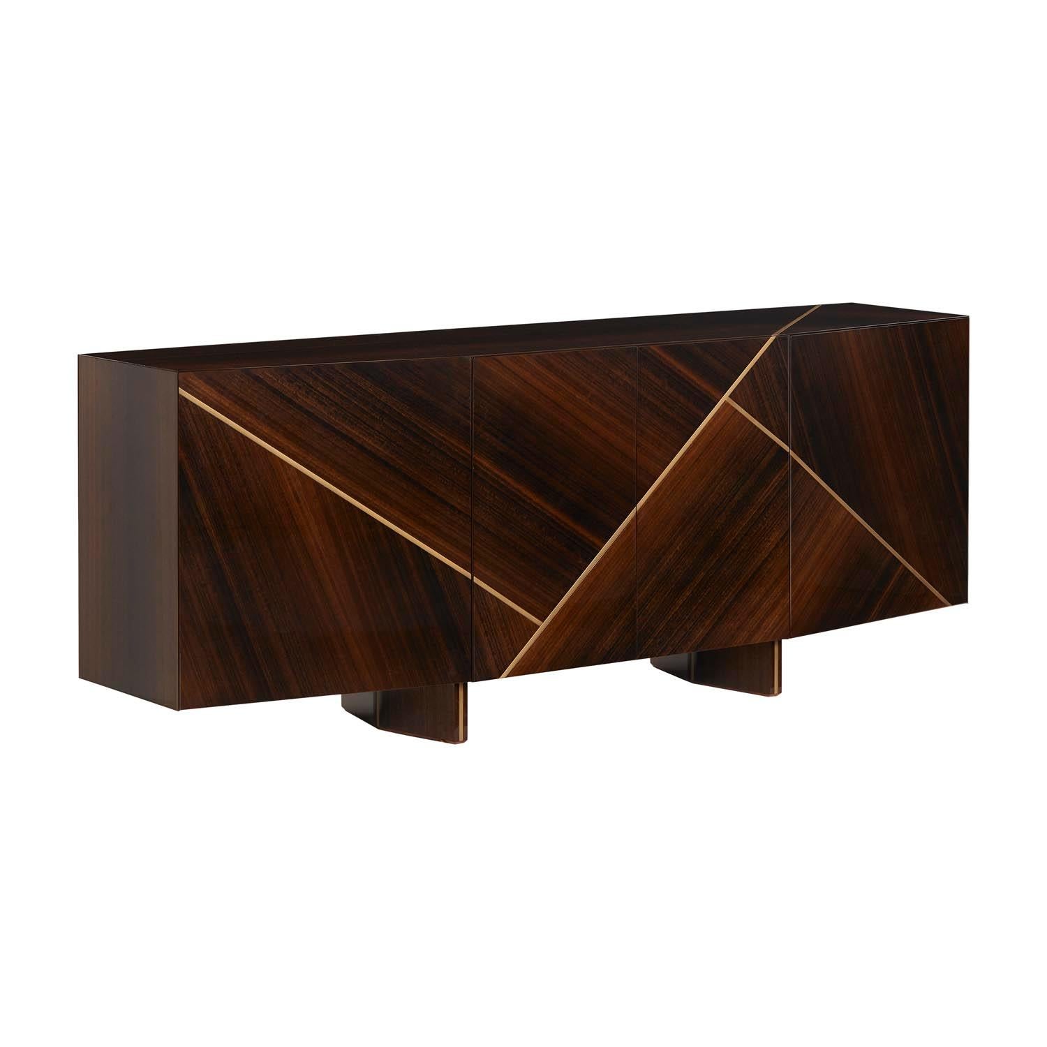 Lorca sideboard is a bold design piece that brings elegance and sobriety to any modern room project. Inlaid details in antique brass color or stainless steel.
 Available in any lacquer or veneered wood on request.

Shown in glossy Eucalyptus Fumé