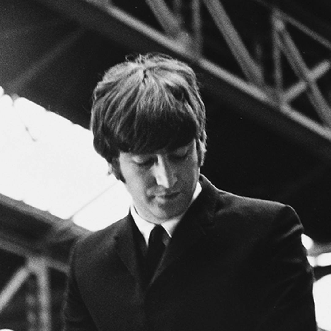 The Beatles, John Lennon sitting on an advertising hoarding I - Print by Lord Christopher Thynne