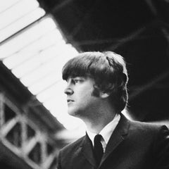 John Lennon sitting on an advertising hoarding at Marylebone Station II