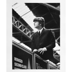 Vintage John Lennon sitting on an advertising hoarding at Marylebone Station II