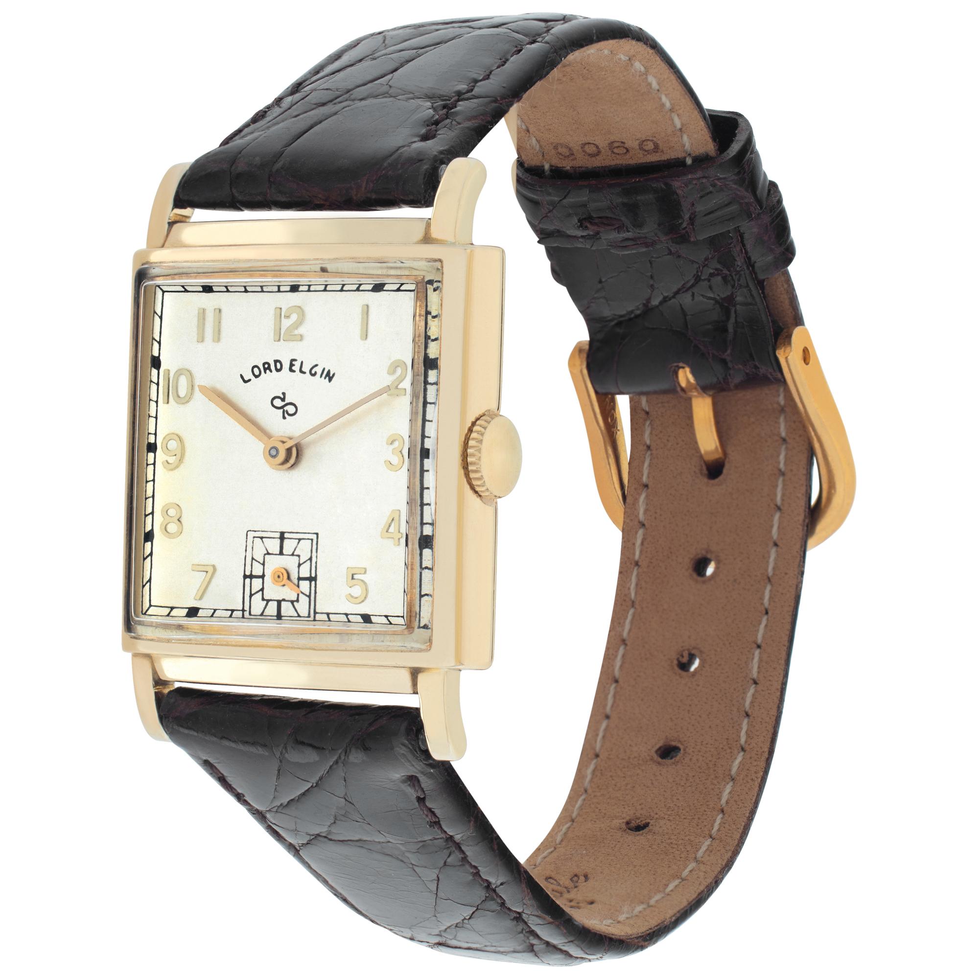 Lord Elgin Classic in 14k on leather strap. Manual w/ subseconds. 24 mm case size. Fine Pre-owned Lord Elgin Watch. Certified preowned Vintage Lord Elgin Classic watch is made out of yellow gold on a Brown Leather strap with a tang buckle. This Lord