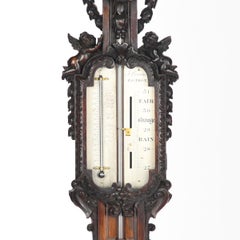 Lord Vernon’s Sudbury Hall lime wood barometer, by J. Braund after Grinling Gibb