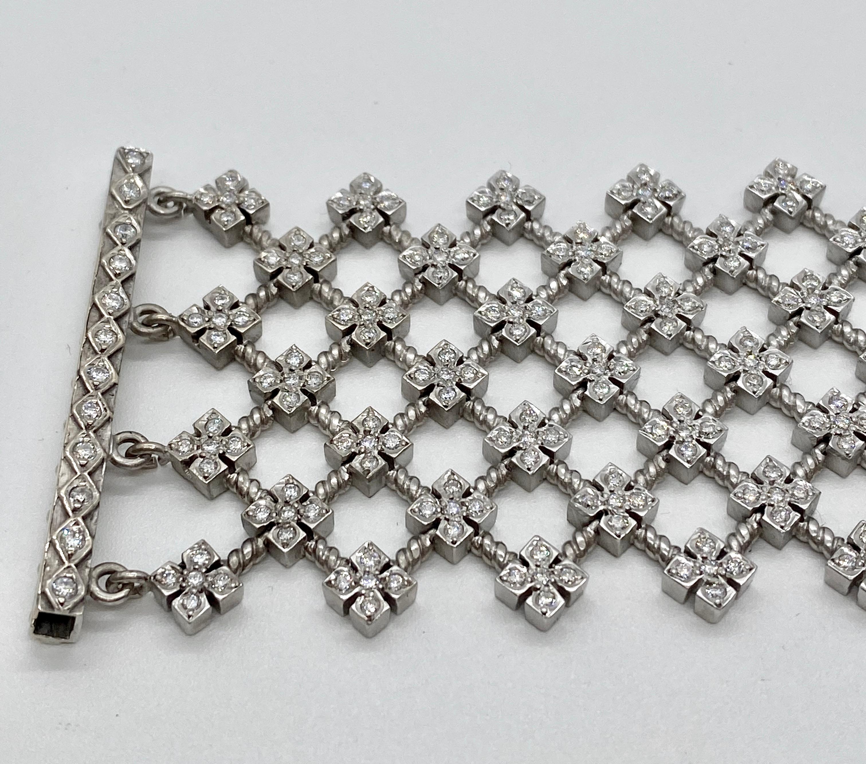 Loree Rodkin 18k white gold diamond cross wide lattice Gothic style bracelet.  Bracelet measure 1.75 inches wide and is 6.5 inches in length.  Diamonds are round brilliant cut and weigh approximately 4.00 carat total weight and are G-H in color and