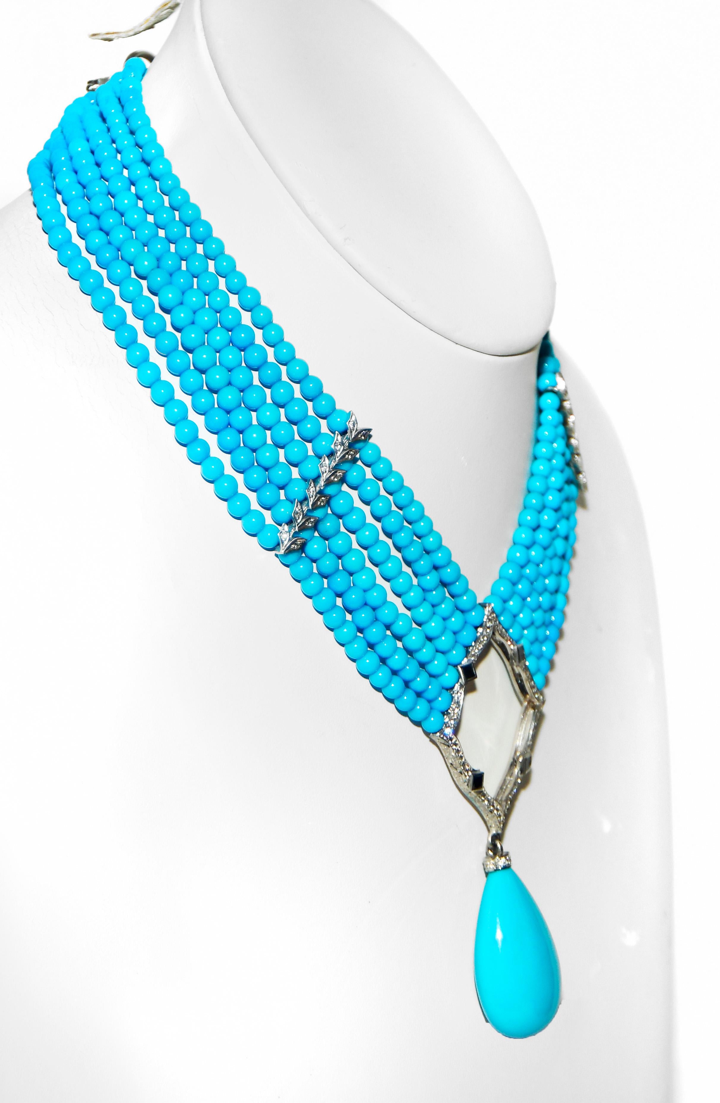 An extraordinary and rare example of Loree Rodkin's fine jewelry.  Six strands of beautifully matched round Sleeping Beauty turquoise beads is just the beginning!  Beads measure 4mm-5mm.  Strands are held together with two 18 karat white gold