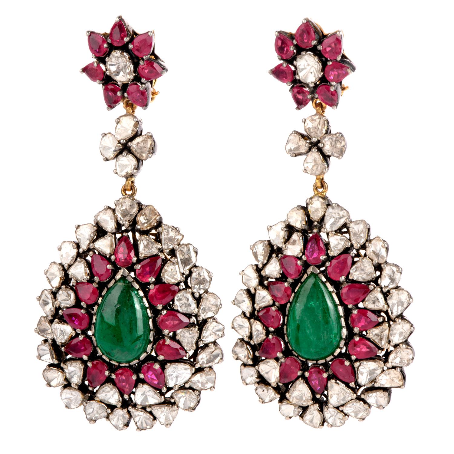 A touch of Green and red for any Holidays.

This stunning pair of 14k gold and silver earrings features a

Dangling design in the center as well as the entire piece. 

Prominent is the pear shaped genuine green Emerald 

swinging freely in the