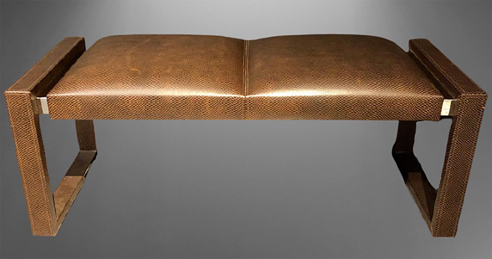 Loren Marsh design bench. New York 2000s. Embossed and stitched leather. Polished stainless steel. Unsigned. This popular box car bench is currently listed at $11,995 on line, approximately four times our listed price. 

In 1975, Lorin Marsh