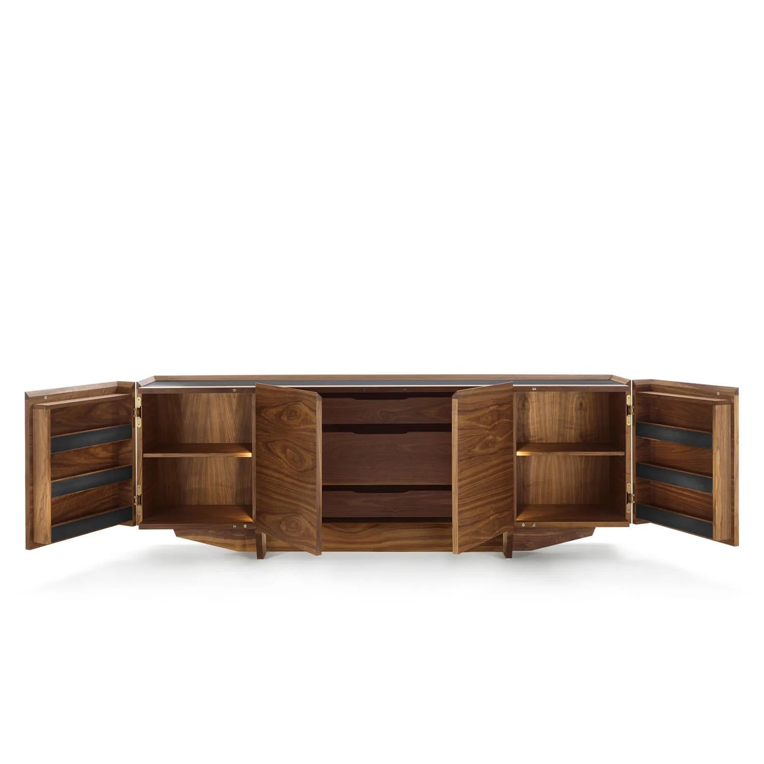 Sideboard Loren with solid walnut structure  with steel top and steel front storage parts 
on 2 inside doors in iron lacquered finish. Lateral doors opening to 180° and contain small 
shelves to hang and store glasses. Sideboard's center part