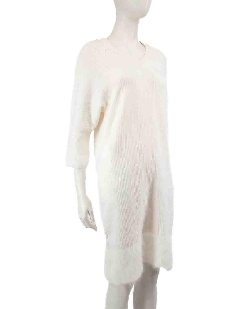 CONDITION is Very good. Minimal wear to knit dress is evident. There is a small mark to the front of the dress on this used Lorena Antoniazzi designer resale item.
 
 
 
 Details
 
 
 White
 
 Wool
 
 Knit dress
 
 Long sleeves
 
 Round neck
 
 Knee