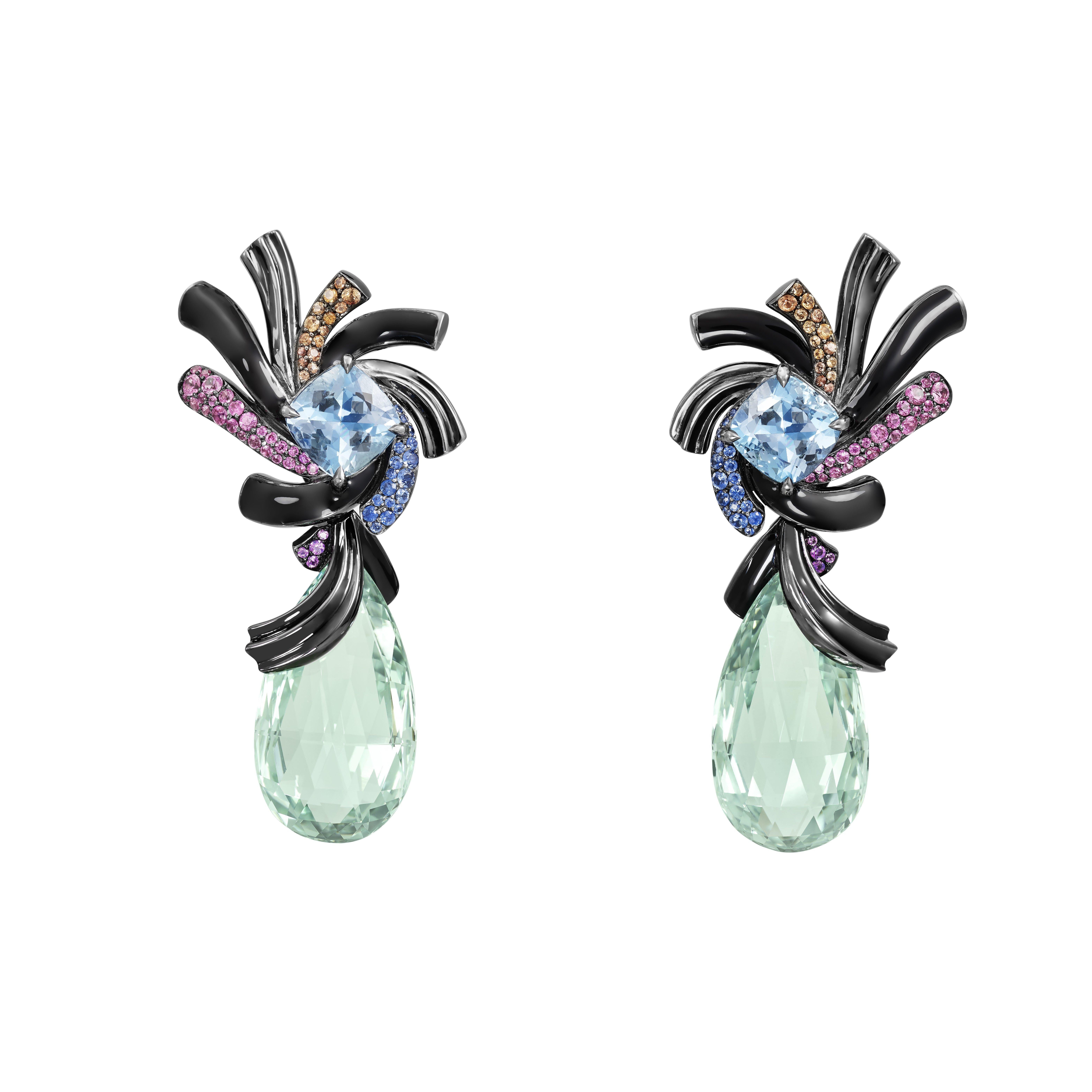 These exceptionnal earrings are part of Lorenz Bäumer's latest Black Magic collection. Composed of white gold, these earrings are playing on volumes and colors with the black color highlighting the numerous coloured stones such as these two green