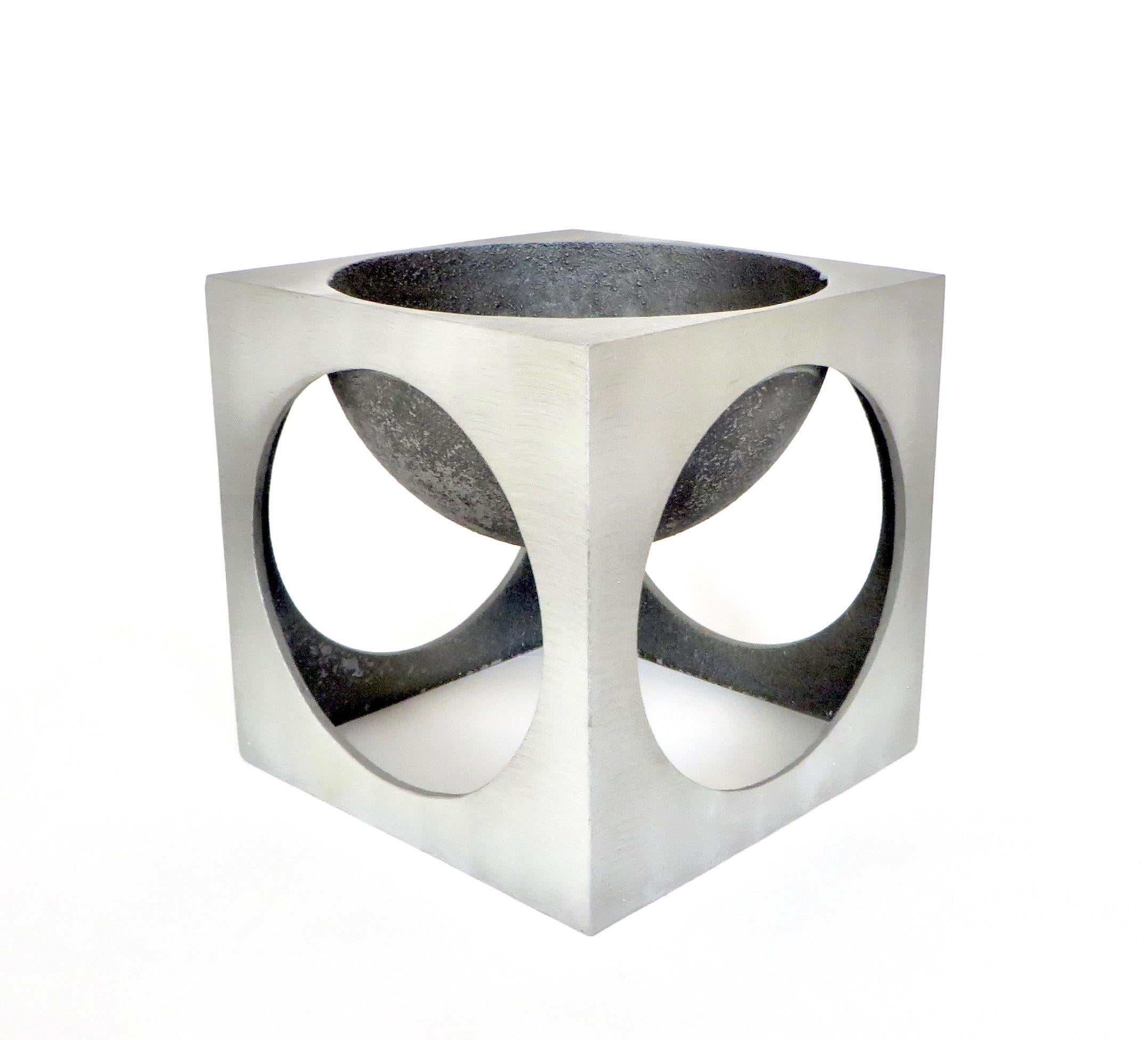 Lorenzo Burchiellaro cast and etched aluminum square sculpture.
Patinaed black and natural etched aluminum composes this open cube with a dish depressed center for either holding various things of your choosing or displaying as pure