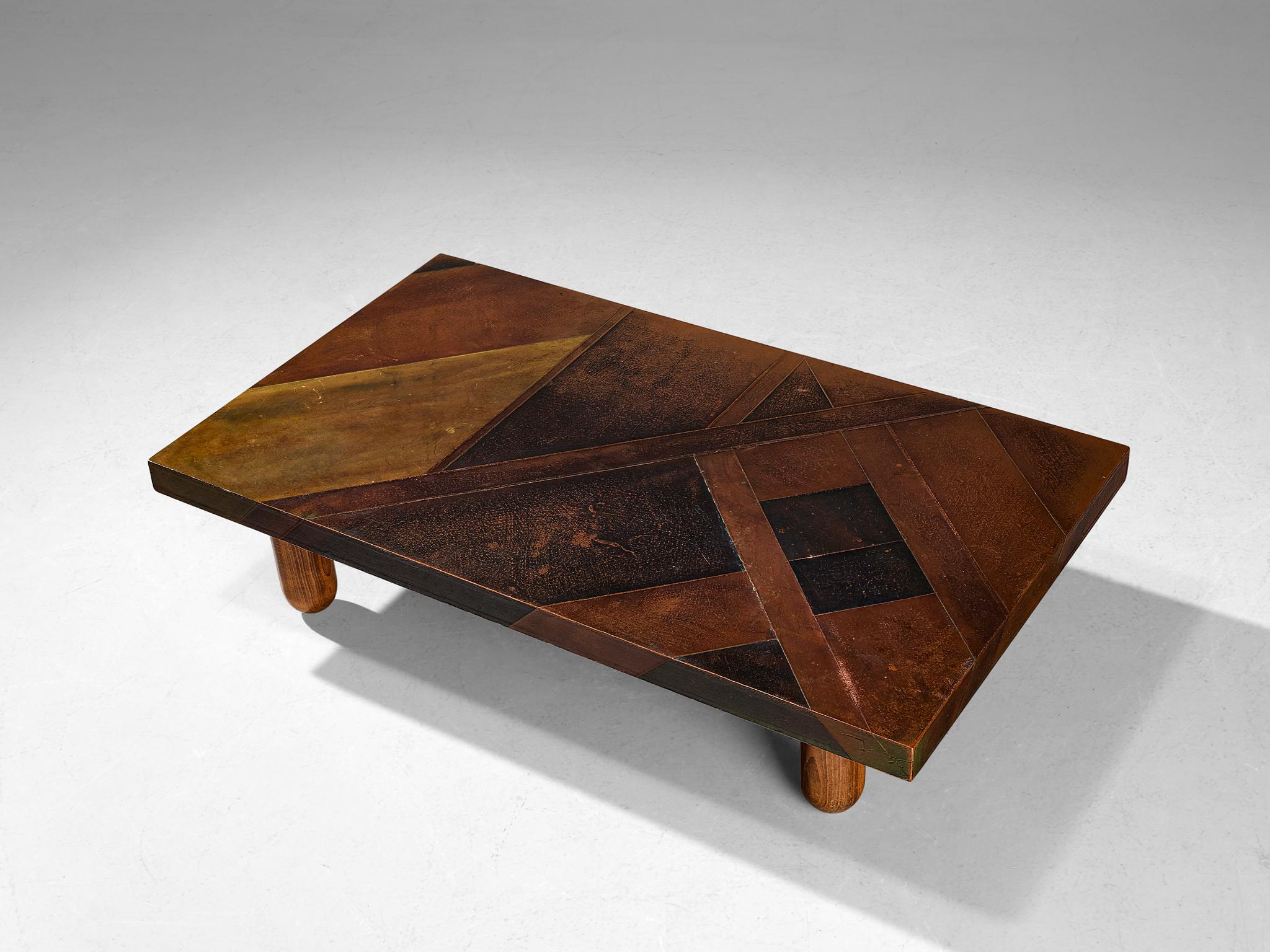 Lorenzo Burchiellaro, coffee table, copper and stained beech, Italy, 1960s.

This coffee table is an absolute eye-catcher. The copper is in beautiful, patinated condition and the vibrant yet natural oxidation and golden color is something out of