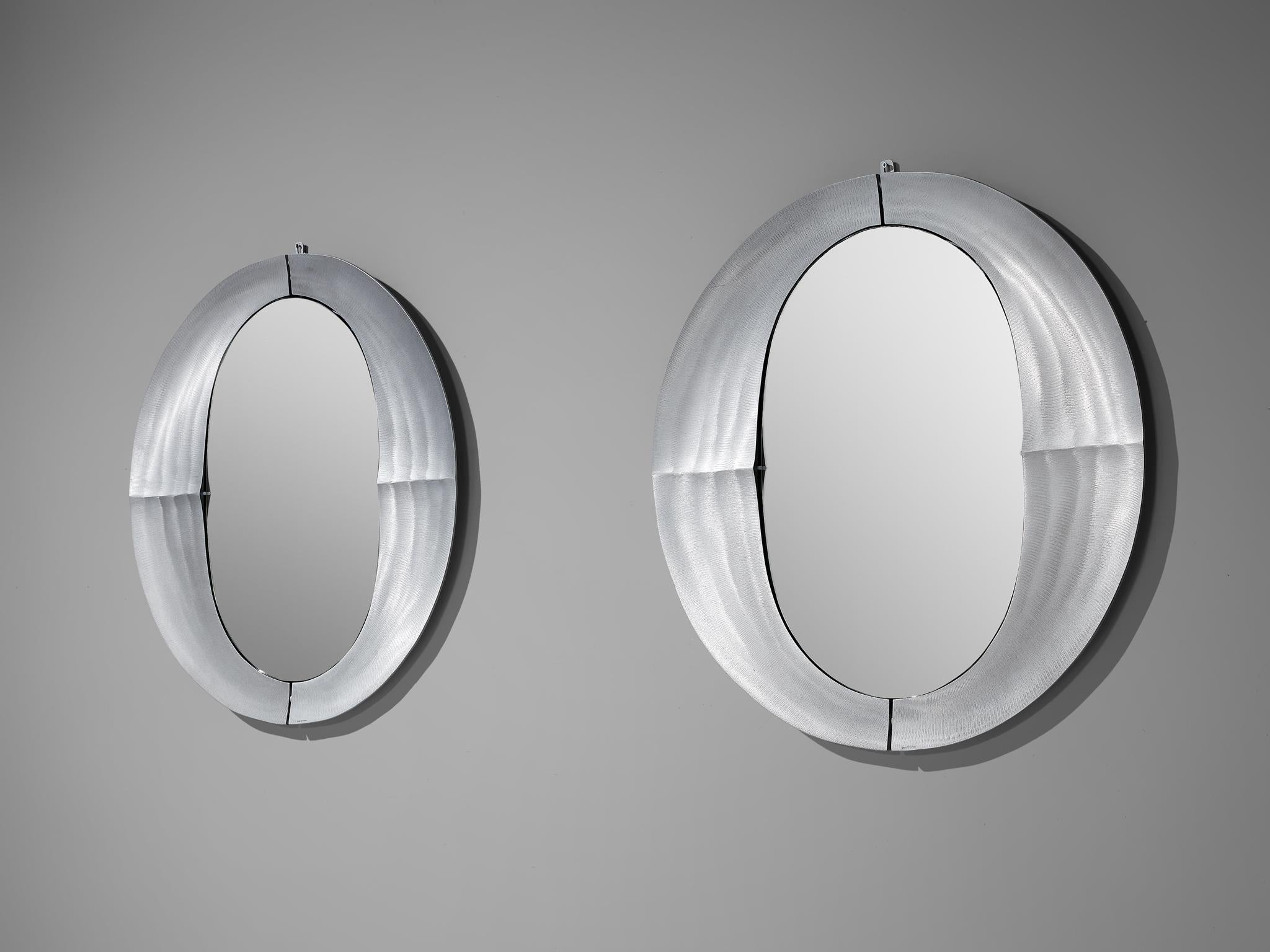 Lorenzo Burchiellaro, wall mirrors model ‘Cuccaro’, aluminum, glass, Italy, 1970s

Stunning wall mirrors by the studio of Italian sculptor Lorenzo Burchiellaro. The oval shaped mirrored glass is surrounded by a round frame that differs in width.