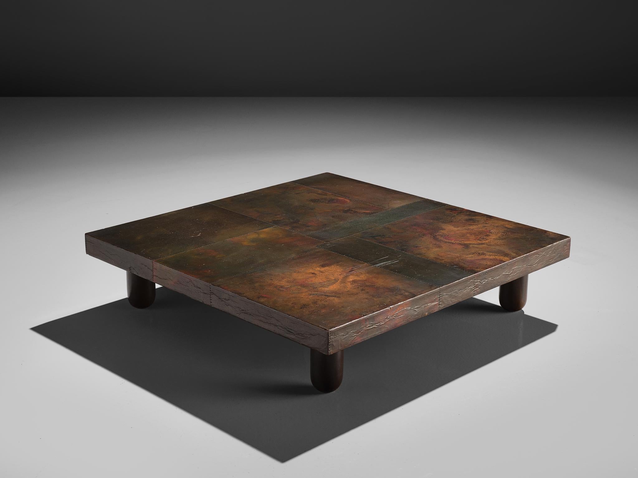 Lorenzo Burchiellaro, handcrafted coffee table, copper, wood, Italy, 1960s 

Lorenzo Burchiellaro is known for his artistic use in metals and the creation of decorative objects and furniture. This side table is no exception. With the square top that