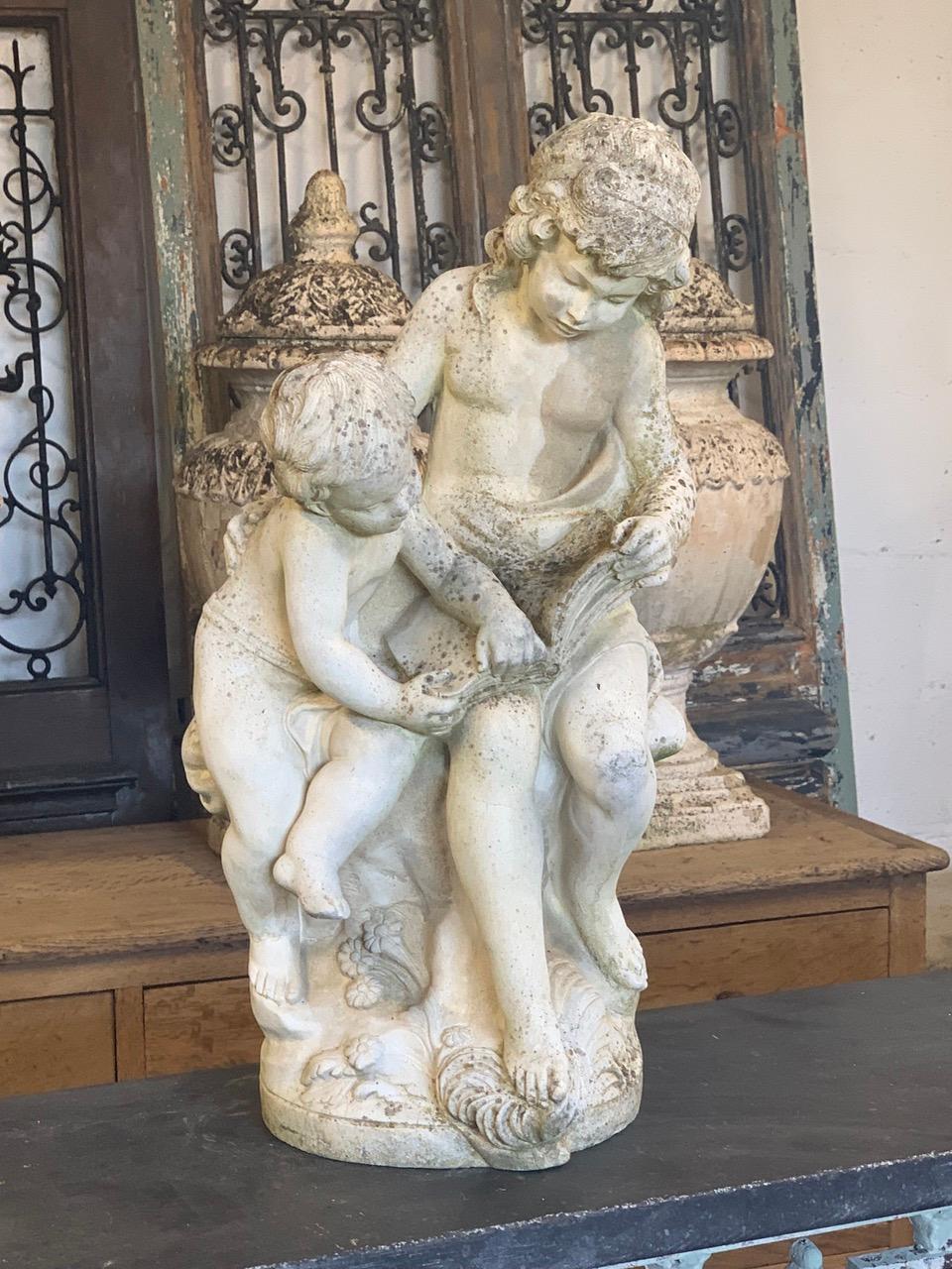 A nice quality composite marble statue by Lorenzo Dal Torrione called CHILDREN AT THE READING. The marble has a nice weathered look which will look nice indoors or in the garden.