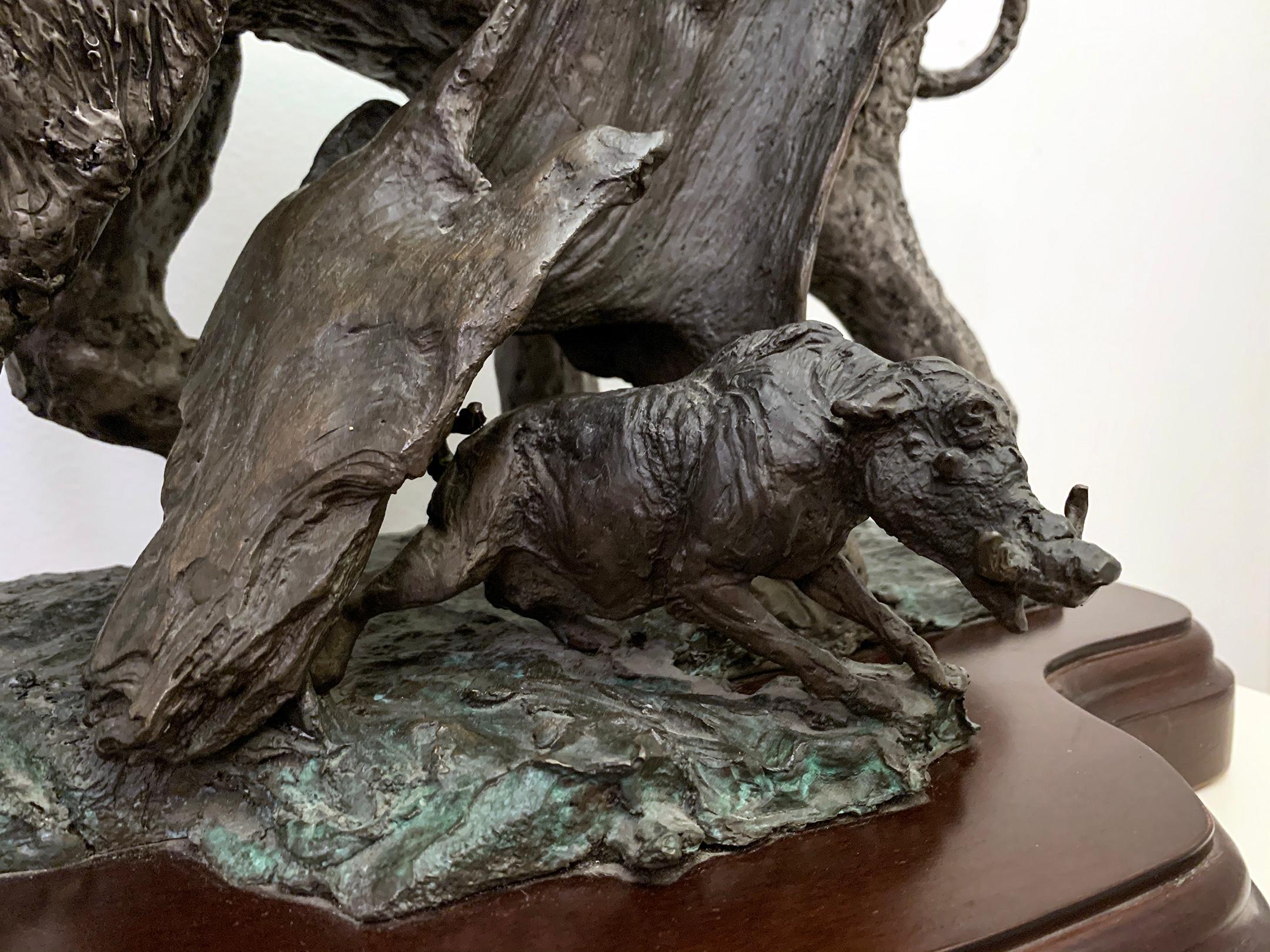 A stunning large bronze sculpture depicting a majestic elephant with a warthog. Signed in bronze, circa 2003, 5/250. Acquired directly from artist.

Lorenzo Ghiglieri is an Oregon artist and sculptor (b. 1931). The Portland, Oregon newspaper