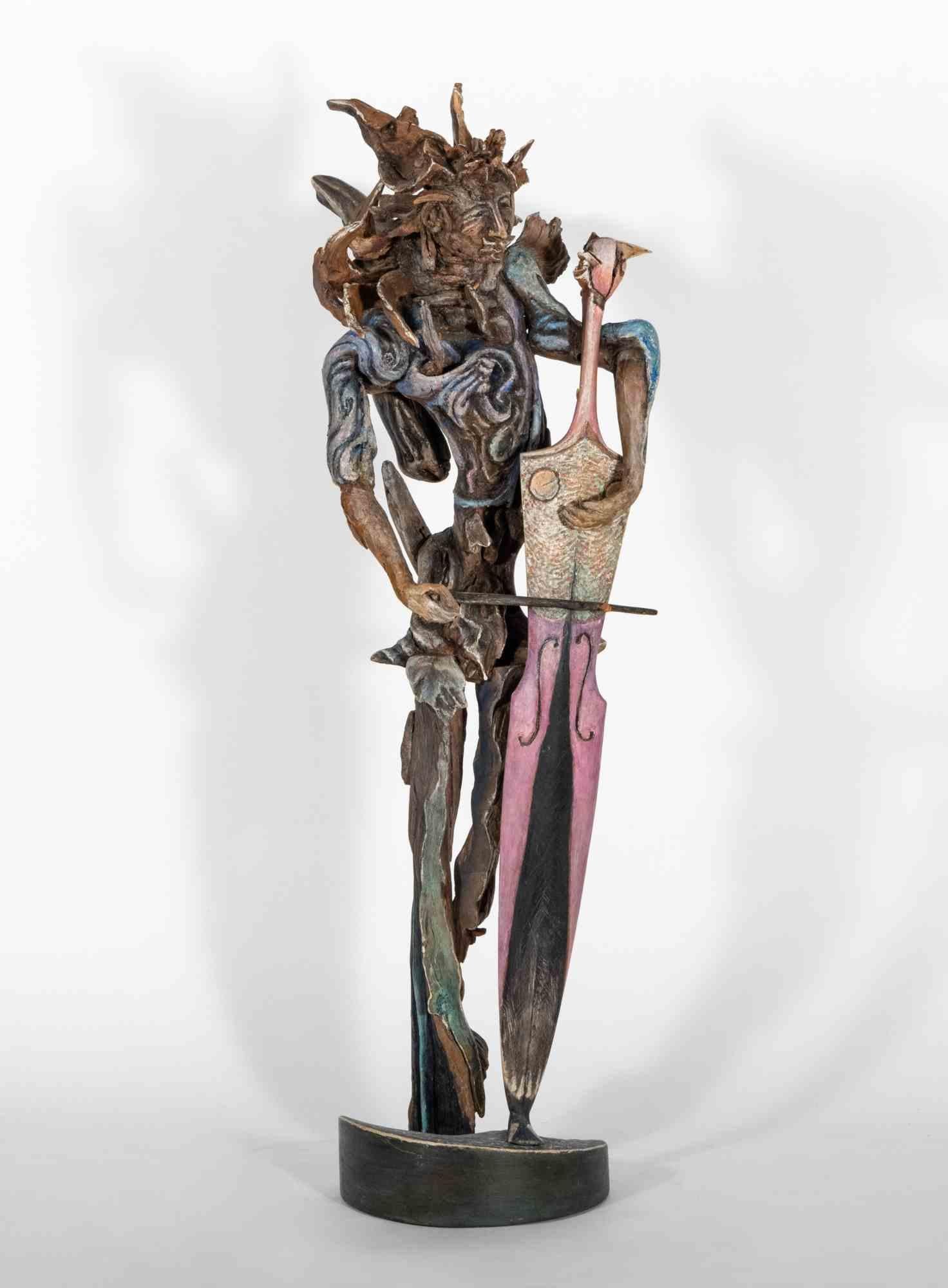 Sehr gut erhaltene Skulptur aus handbemaltem Holz des Bildhauers Lorenzo Servalli, die im Jahr 1998 die Beschwörung der Inspiration erzählt.  Wie ein einsamer Musiker, der einer farbenfrohen und mächtigen Symphonie Leben verleiht, symbolisiert durch