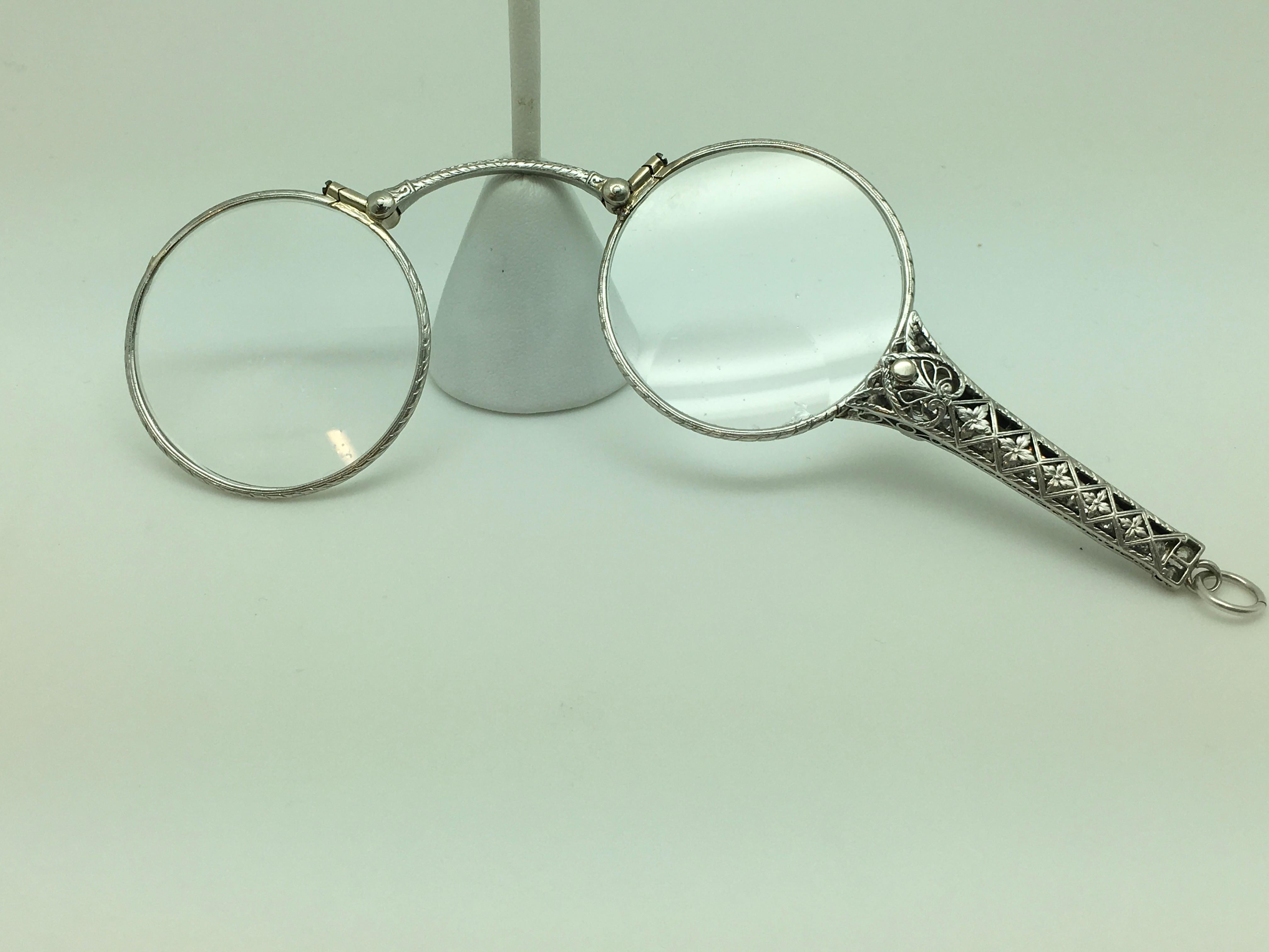 Lorgnette 
18 European Cut with 6 mixed cut, with 4 single and 2 Round Brilliant  Cut (located on either side of the major Diamond, near head of handle).
There are 20 total Diamonds for an approximate total combined Weight of 2.00 Carat by