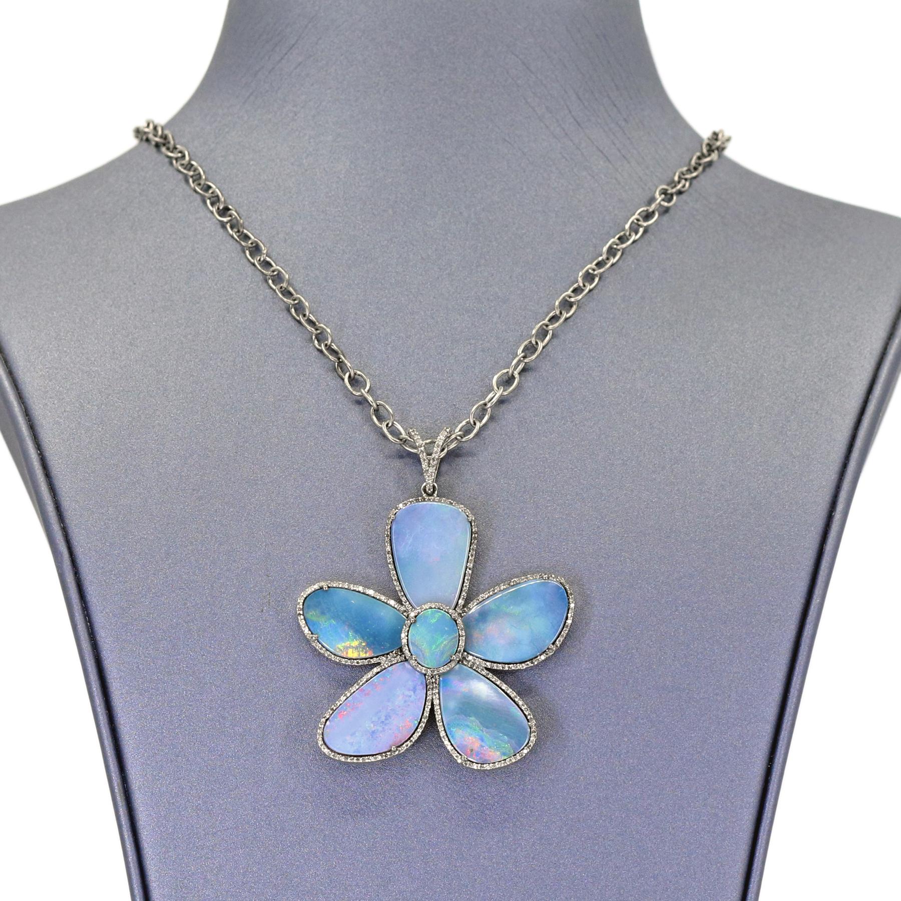 One of a Kind Flower Pendant in rhodium sterling silver by jewelry designer Lori Barros showcasing six fiery, matched blue Australian opal doublets prong set and bordered with pave' diamonds beneath a pave diamond double bail. Multiple chain options