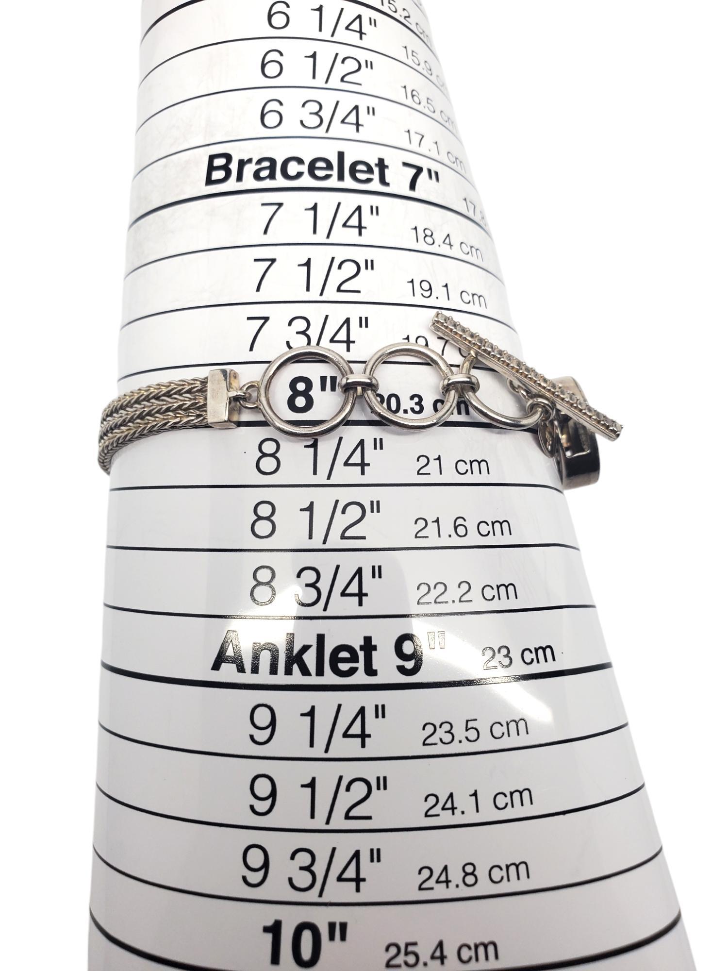 Lori Bonn Sterling Silver Slide Peace Bracelet -

This bracelet features multi chain strands with slide charms - one amethyst cluster & one peace sign in sterling silver by Lori Bonn .

Size: 8 in in length

Stamped: LORI BONN 925

Weigh: 13.4 dwt /