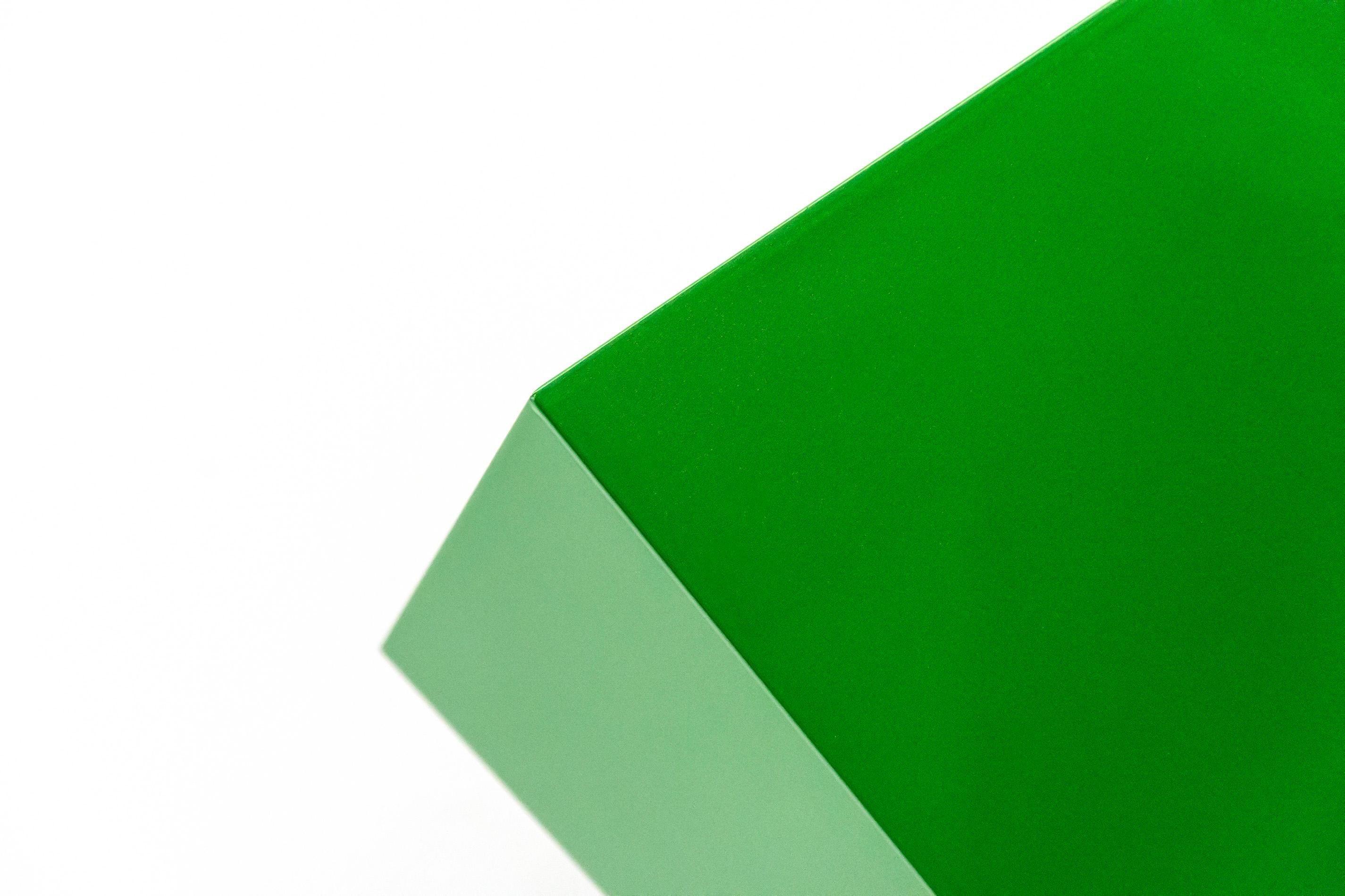 As glossy and reflective as the finish on a sleek corvette, this electric green, geometric wall sculpture by Lori Cozen-Geller is inspired by California car culture, 1960’s minimalism, and the unique musings of its creator. ‘On Point’ pays homage to
