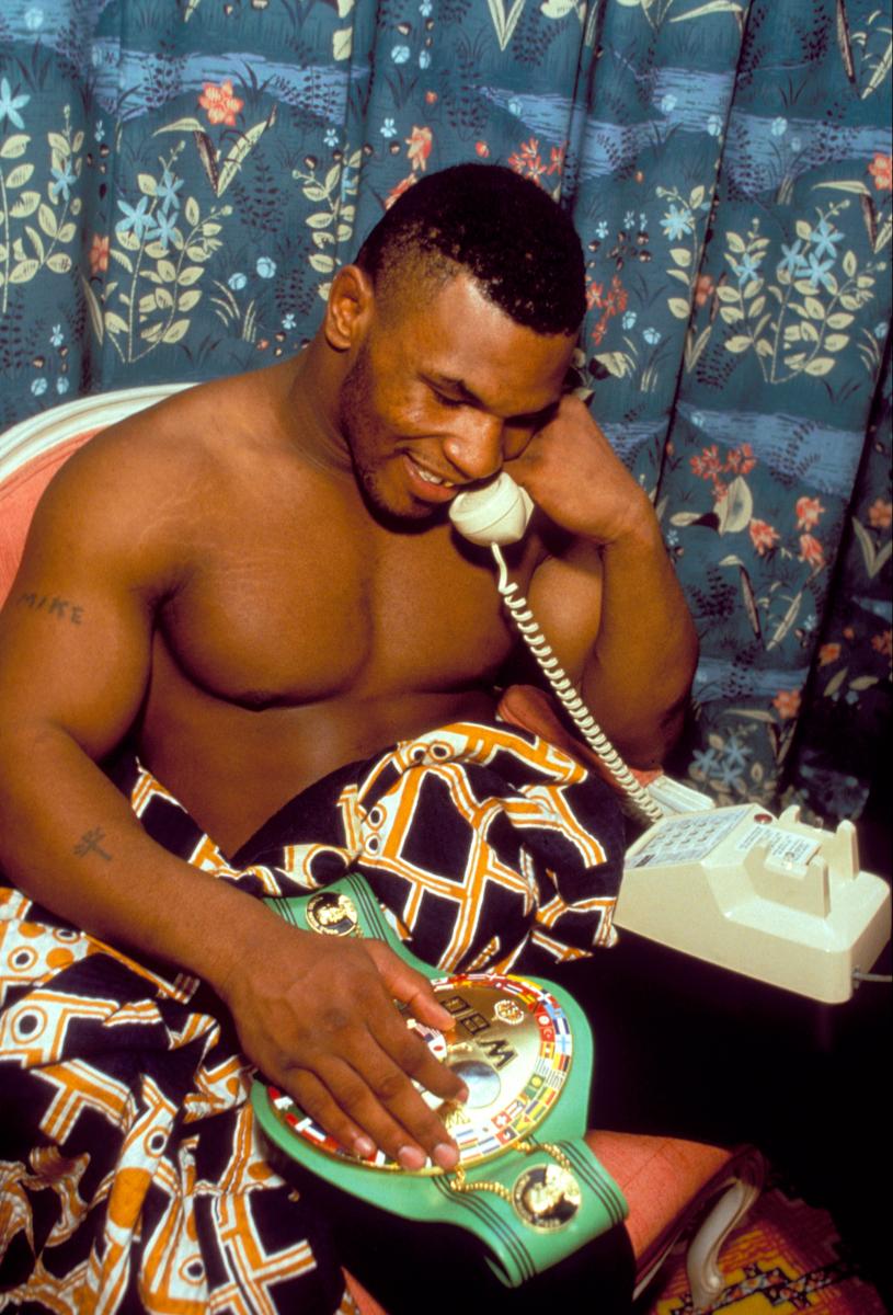 Lori Grinker Portrait Photograph - Untitled (Phone Call) [Mike Tyson speaking with Camille Ewald]