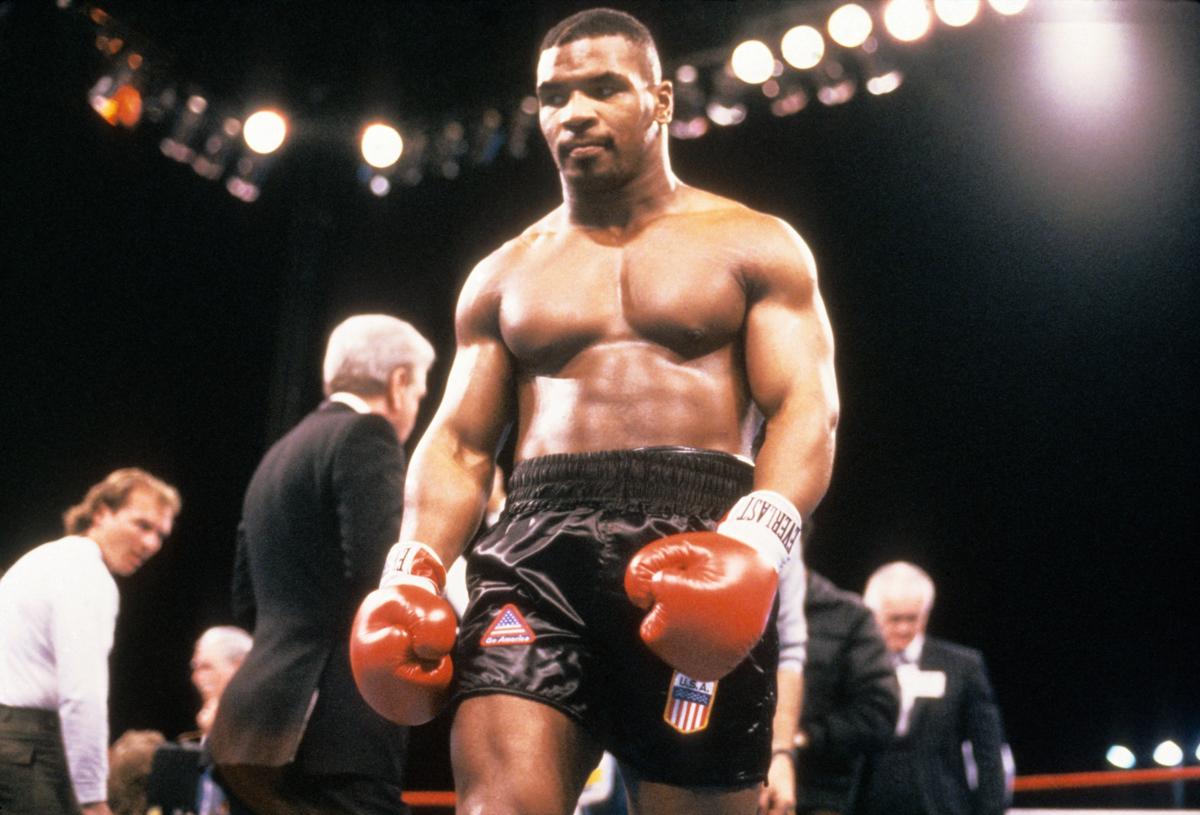 Untitled (WBA Championship) [Mike Tyson in ring for “Bonecrusher” Smith bout] - Photograph by Lori Grinker