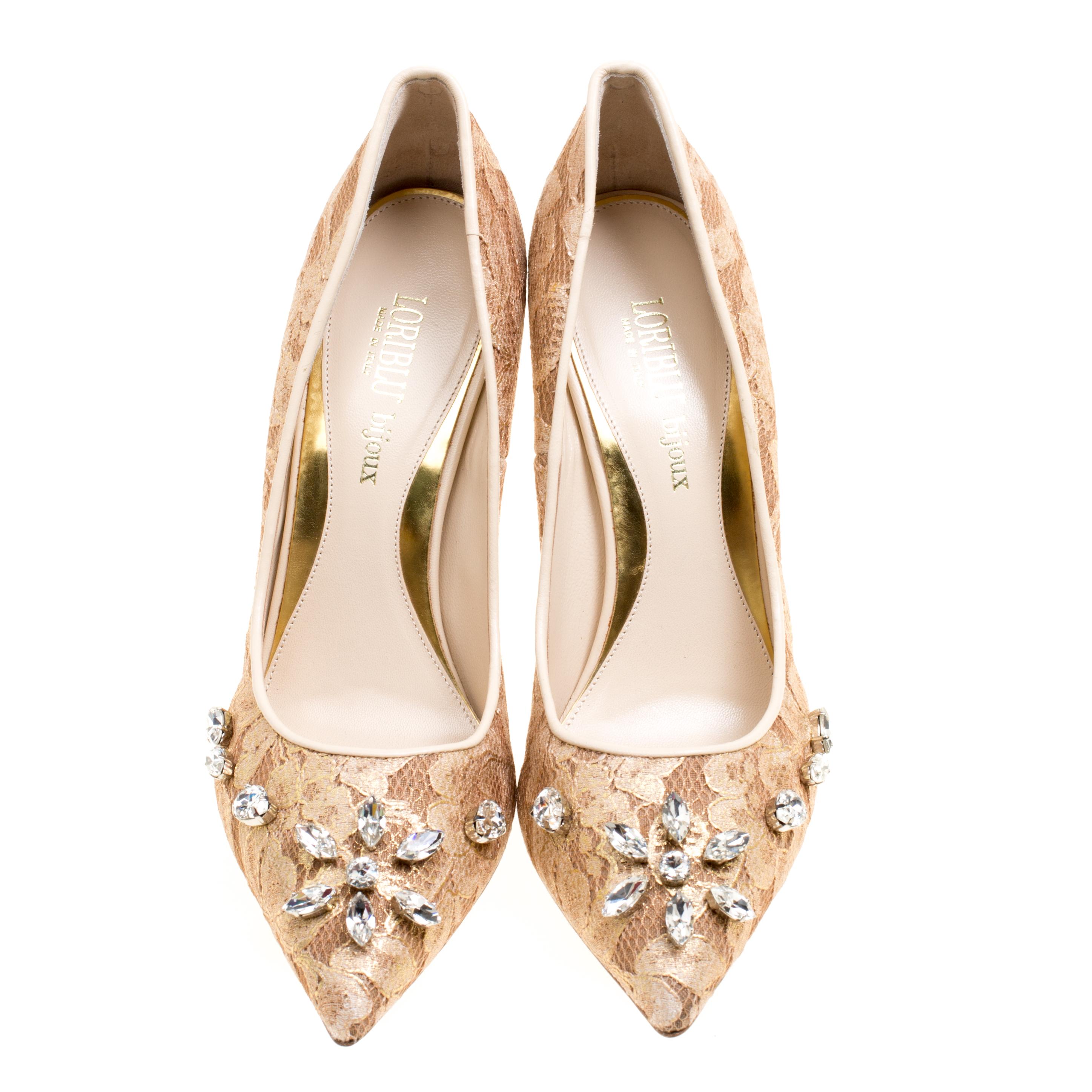 These beige pumps are crafted from a combination of lace, mesh and leather and feature an elegant silhouette. They flaunt pointed toes with exquisite crystal embellishments and come equipped with leather-lined insoles and 11 cm stiletto heels. Pair
