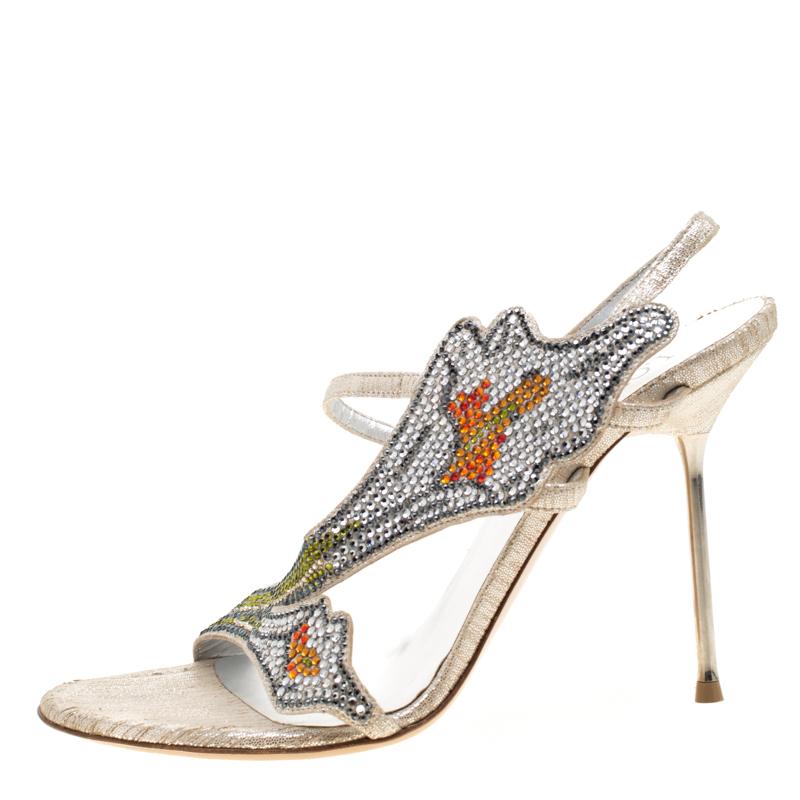 Every fashionista needs a pair of shoes that have an edge, like these slingback sandals from Loriblu. They've been crafted from suede and decorated with multicolored embellishments over the vamps. The sandals are complete with buckle-held slingbacks