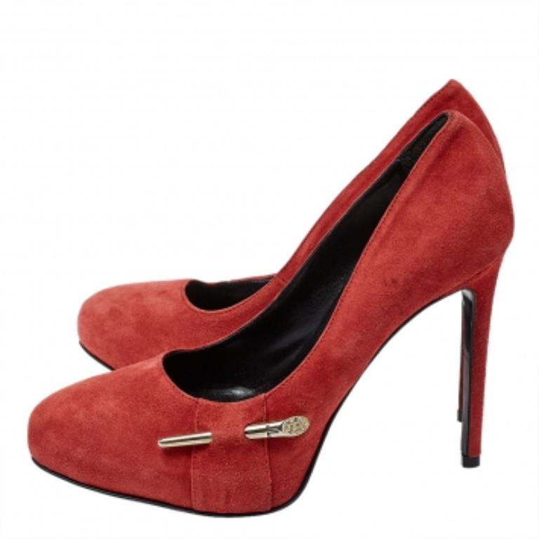 Fashionable and chic, these pumps from Loriblu will cut an alluring silhouette from day to night. Crafted from suede, the pumps have a red shade, a gold-tone, crystal-embellished metal detail, concealed platforms, and 11 cm heels.
