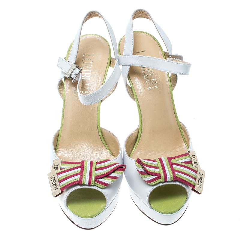 The fun use of colours make these sandals from Loriblu a must-have pair for your wardrobe. Anyone who loves quirky, fun style will find these sandals, irresistible. They are rendered in white leather and feature a front strap accented with ribbons