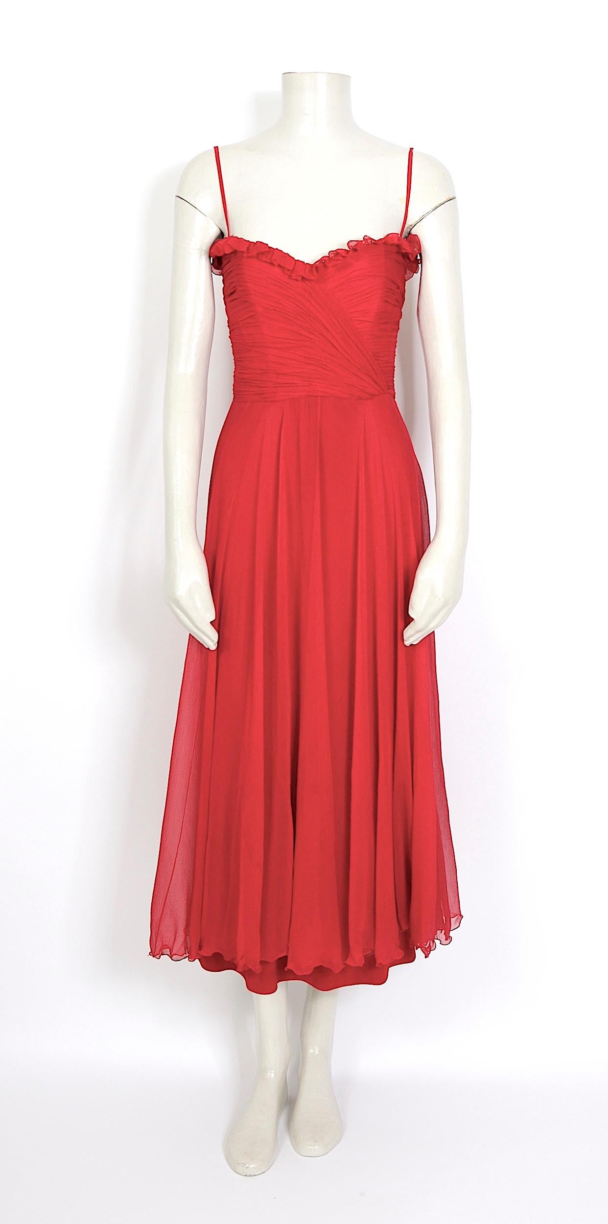 This spectacular vintage 1970s Loris Azzaro evening dress features a boned bustier draped bodice. It closes with the original back zipper. There are delicate shoulders straps attached to the interior of the dress so you would have the option to wear