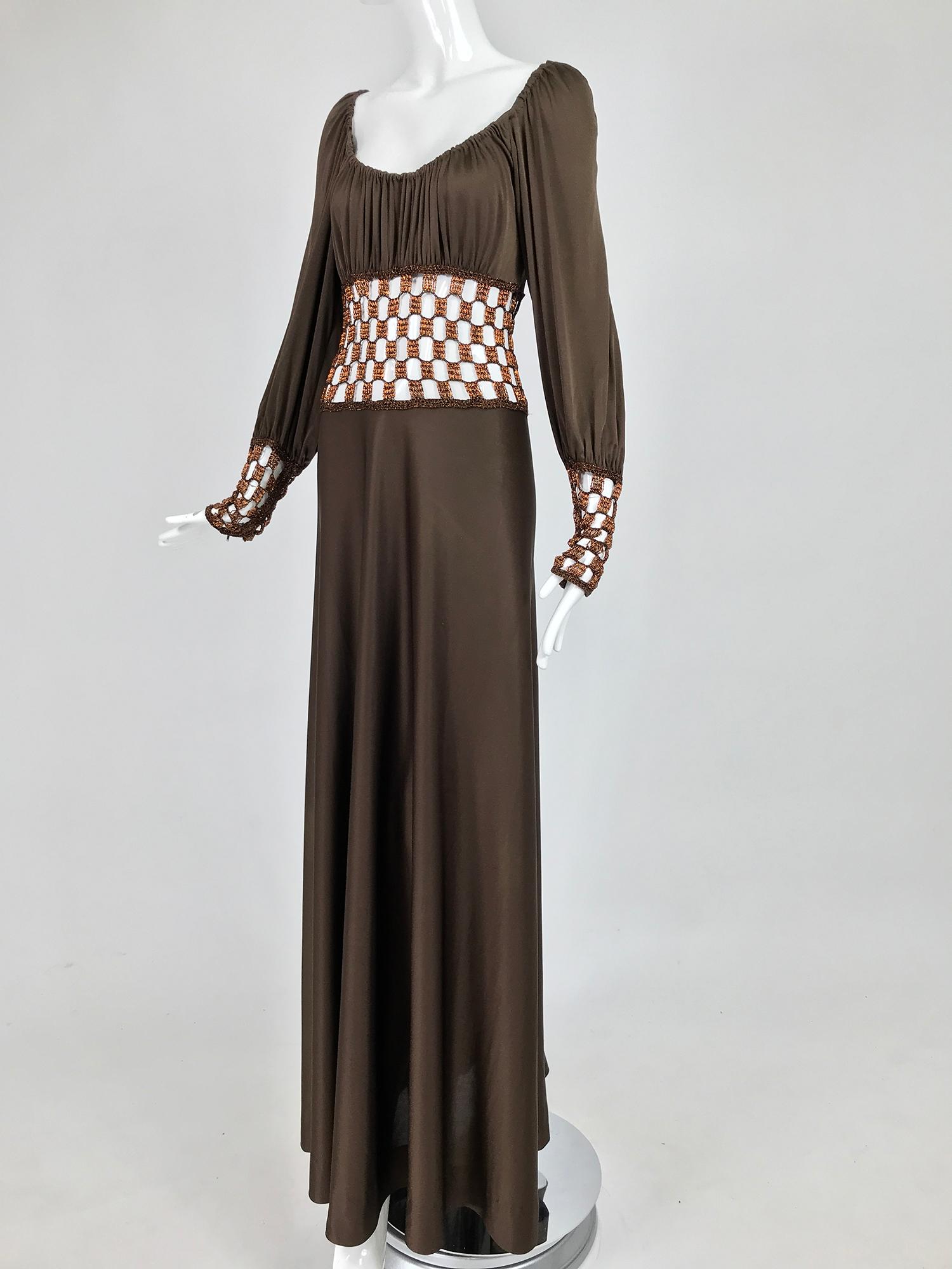 Loris Azzaro Couture metal chain and jersey maxi dress from the 1970s. This amazing dress is hand made of silky bias cut, chocolate brown jersey, the low scoop neckline is gathered at the front, shoulders tops and upper back edge. The waist of the