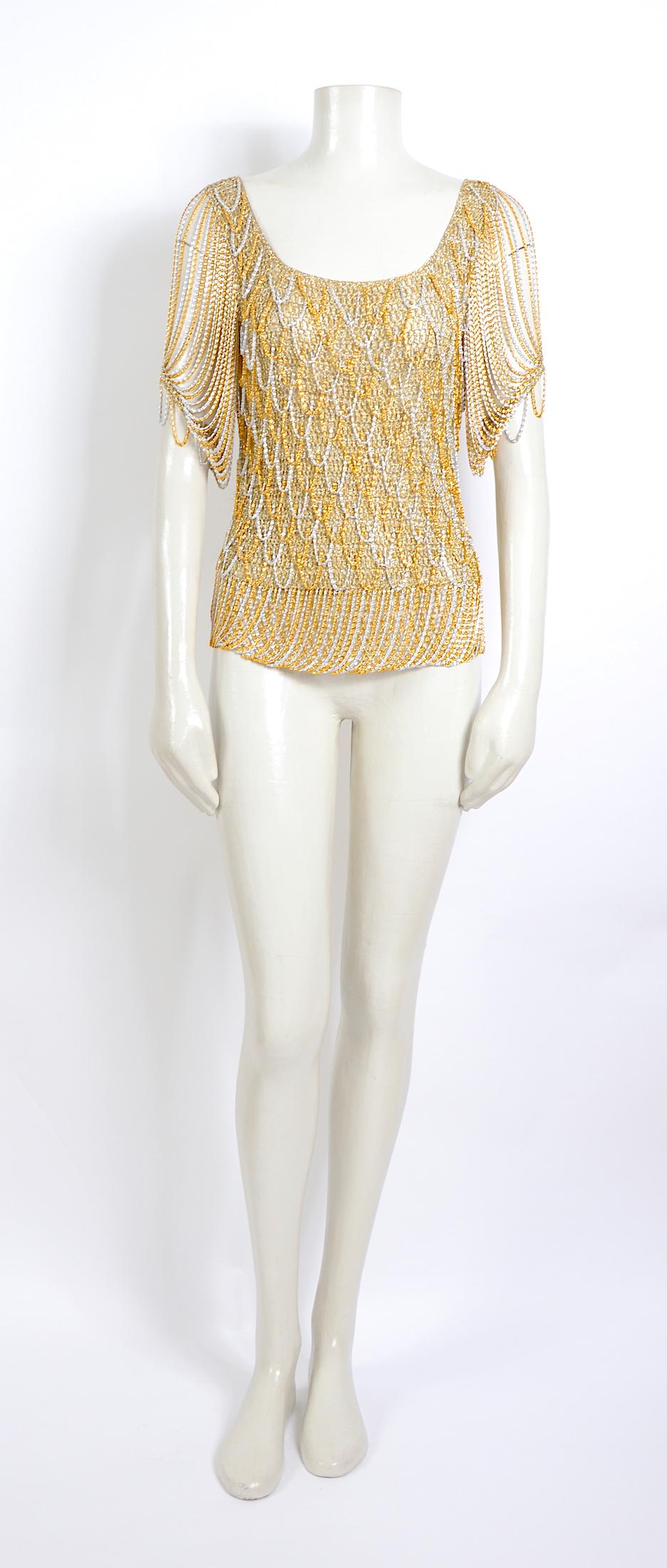 1970s Loris Azzaro French hand-crocheted lurex and gold /silver metal chain fringe at sleeves, hem and knit into the lurex at the bodice. 
In excellent condition - no size tag.
Measurements 
Underarm to Underarm flat 15inch/38cm(x2) 