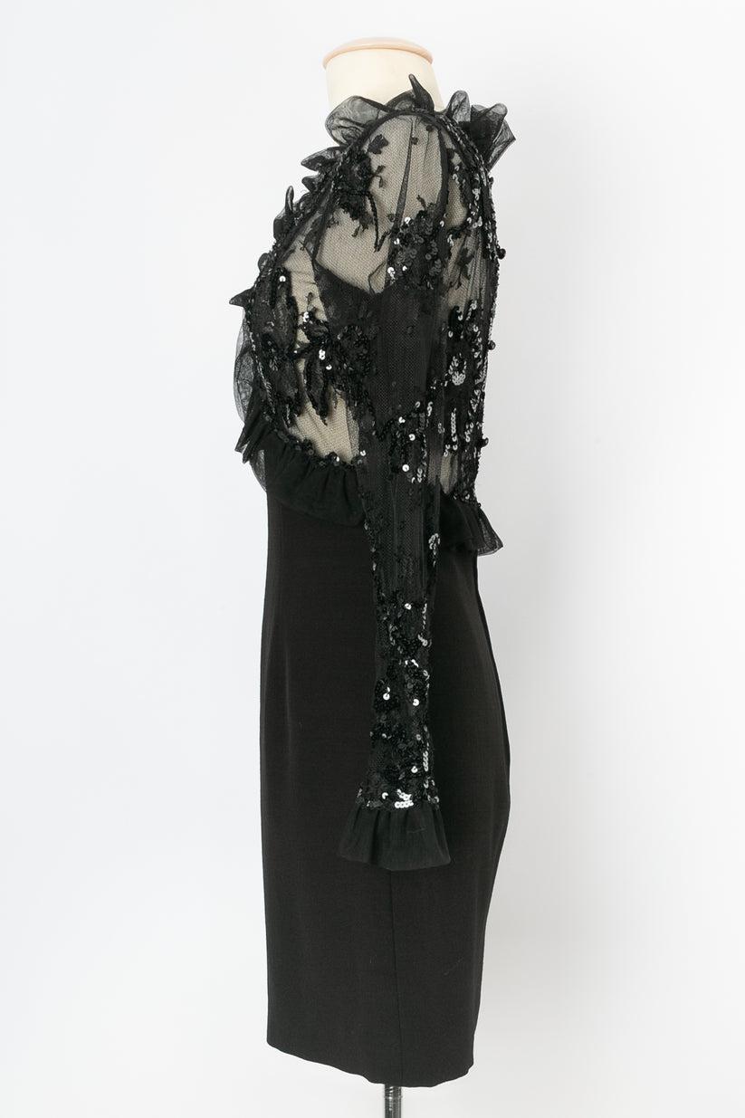 Loris Azzaro (Made in France) - Knee-length dress in black jersey and lace, decorated with sequins and emphasized with flounces. No composition or size tag, it fit a size 36FR.

Additional information: 
Dimensions: Shoulders: 36 cm (14.17