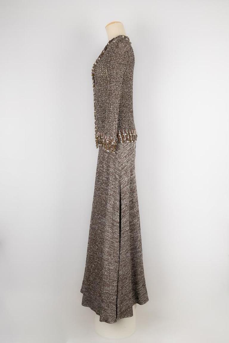 Azzaro - (Made in France) Set aus den 1970er Jahren, bestehend aus einem Oberteil aus Mesh, das mit silbernen und rostfarbenen Kettchen und Perlen verziert ist, und einem Rock aus Jersey. Keine Größe noch Zusammensetzung Label, es passt ein