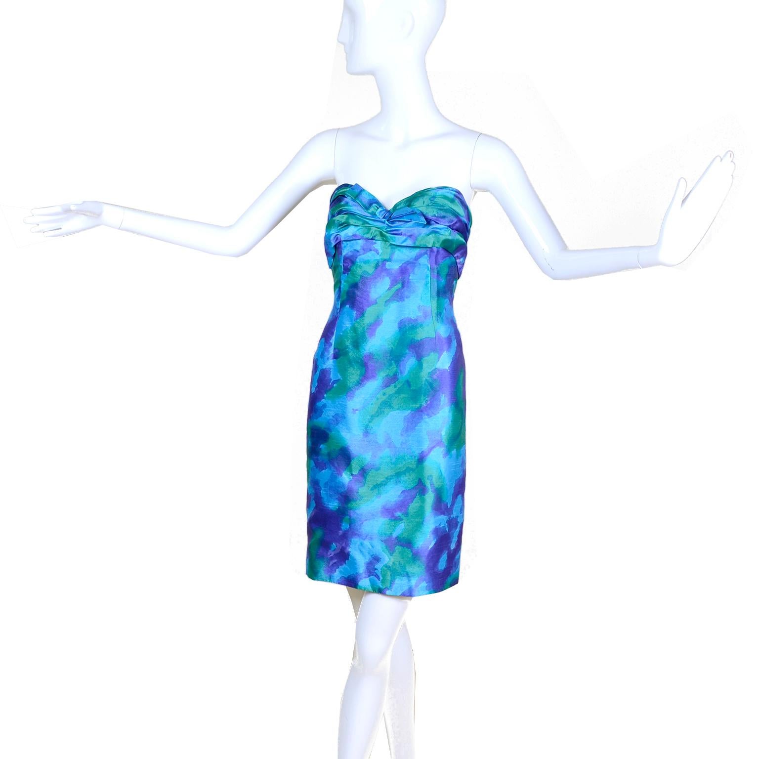 This beautiful Loris Azzaro Paris vintage watercolor silk strapless cocktail or party dress was made in France in the 1980's. This stunning dress is in rich saturated shades of blue, deep purple and green. The bodice has a built in bra and the dress