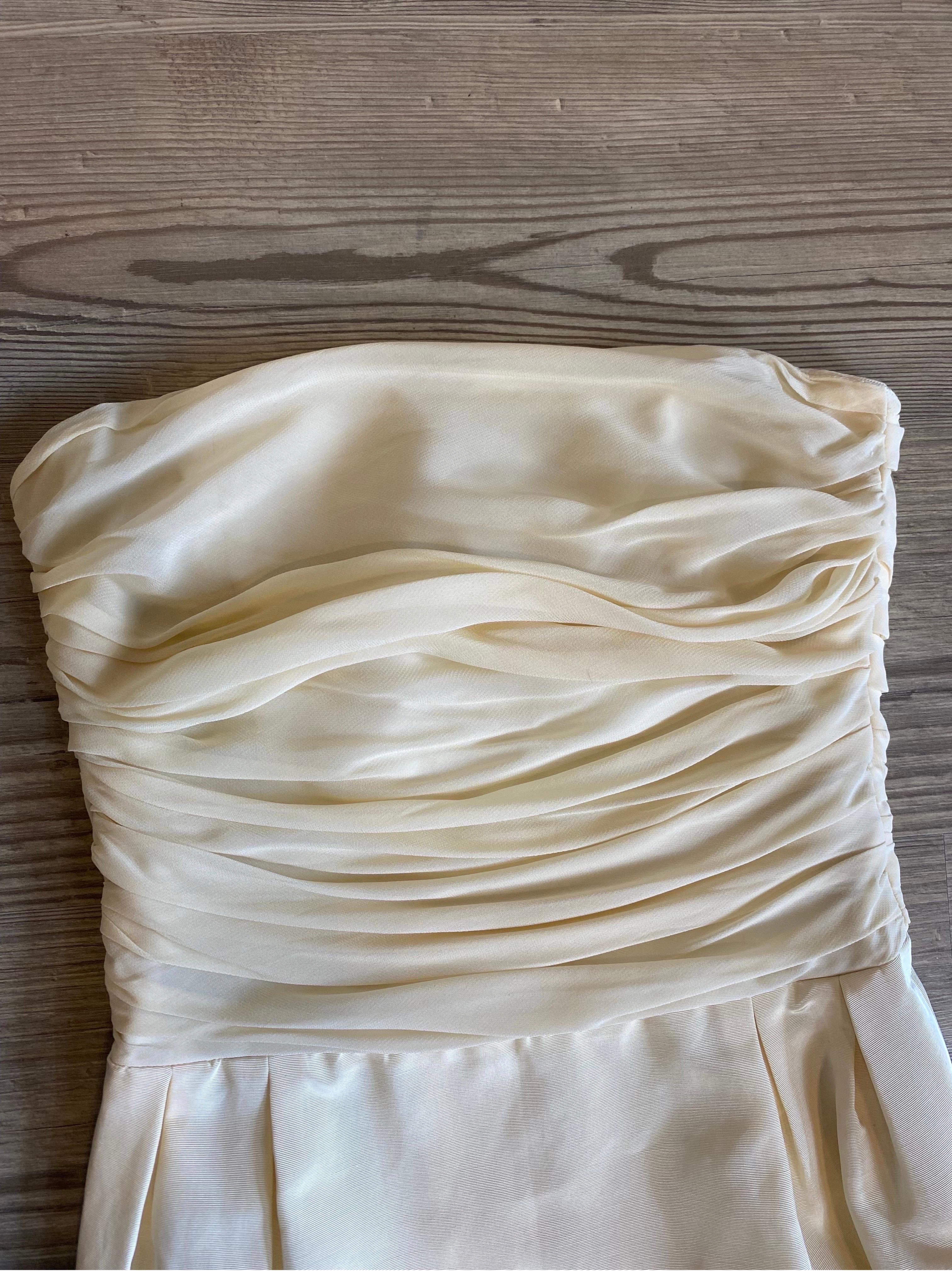 Loris Azzaro white bustier dress 
No composition label, considers both viscose and cotton.
Bodice part draped in tulle.
Zip on the back. No sleeves.
Inner lining. 
Size 46 French.
Breast 35
Bust 37
Length 79
In excellent overall condition, shows