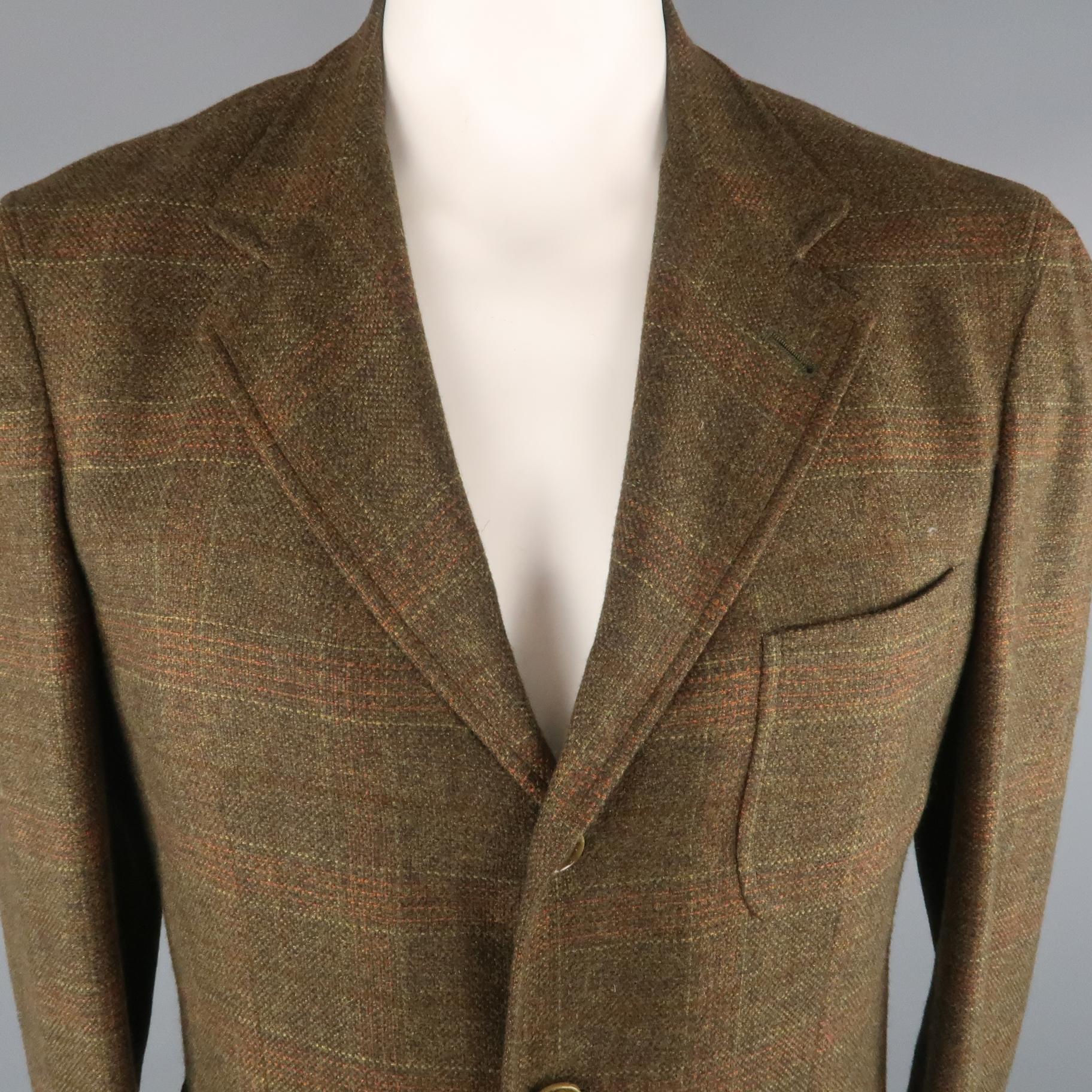 LORO PIANA Sport Coat comes in brown tones in a plaid cashmere material, with a notch lapel, patch pockets, 3 buttons at closure, single breasted, double vent at back, unlined. Made in Italy.
 
Excellent  Pre-Owned Condition.
Marked: IT