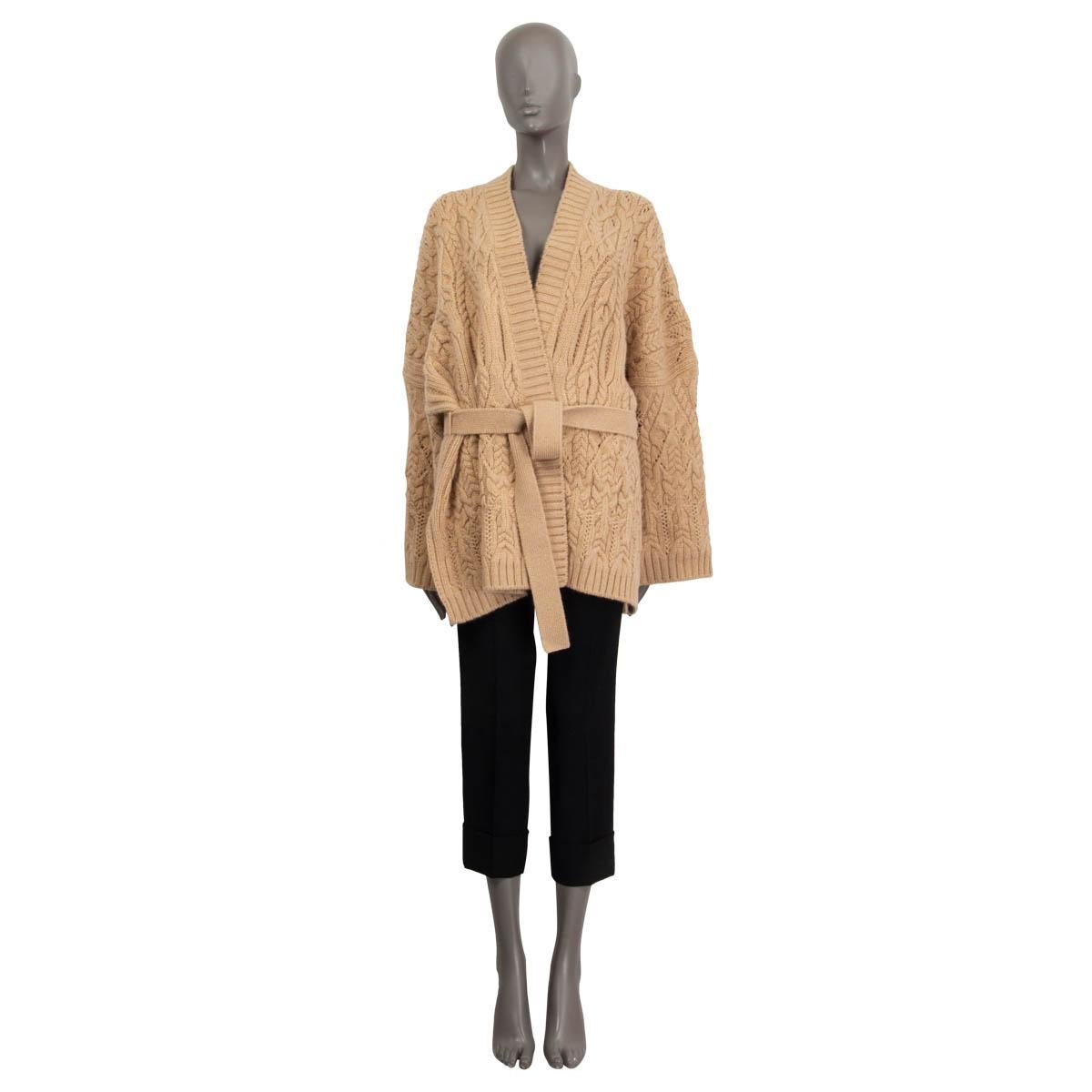 100% authentic Loro Piana 'Finsbury' wrap cardigan in sand cashmere (100%). Features a combination of ribbed and cable-knit elements and a self-tie belt. Unlined. Has been worn once and is in virtually new condition. 

Measurements
Tag