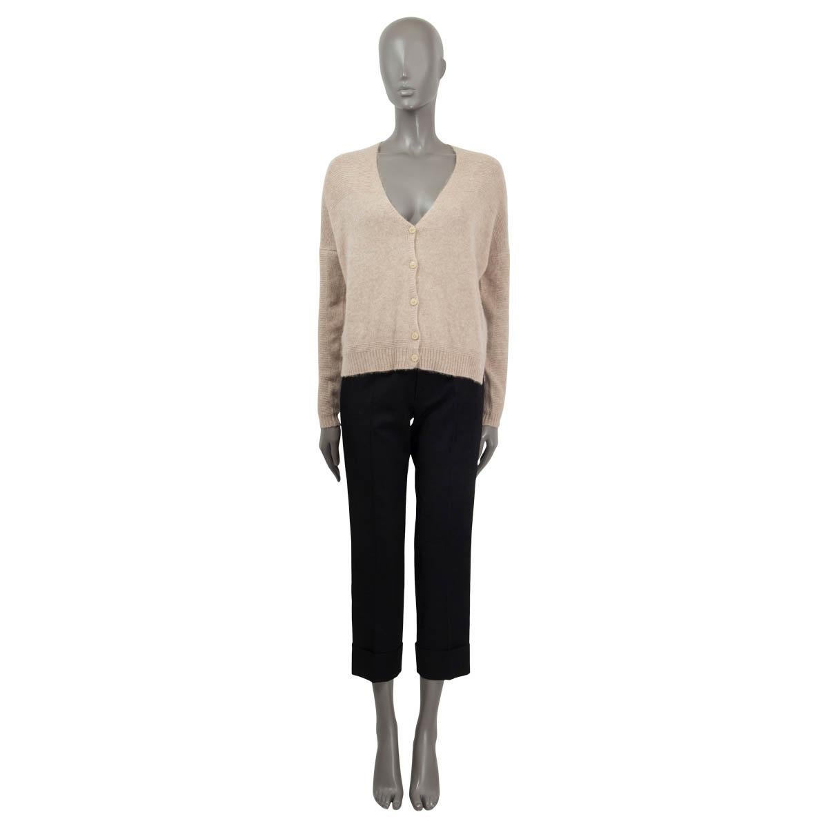 100% authentic Loro Piana fine knit cardigan in beige cashmere (60%) and silk (40%). Opens with five ivory colored buttons in the front and features cropped cut, a V-shaped neckline and ribbed cuffs and hem. Has been worn and is in excellent