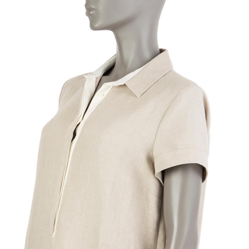 100% authentic Loro Piana short-sleeve shirt dress in beige linen (100%) and off-white silk (94%) and elastane (6%). With flat collar , folded cuffs, and two slit pockets on the sides. Closes with concealed buttons on the front. Unlined. Has been
